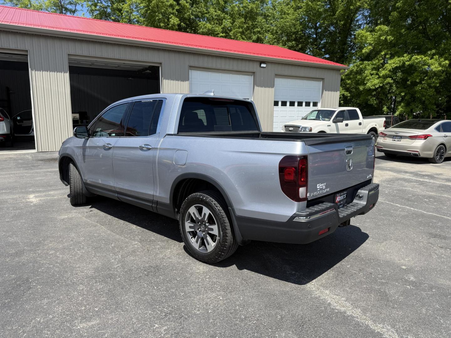 2018 Silver /Gray Honda Ridgeline RTL-E AWD (5FPYK3F79JB) with an 3.5L V6 SOHC 24V engine, Automatic transmission, located at 547 E. Main St., Orwell, OH, 44076, (440) 437-5893, 41.535435, -80.847855 - 2018 Honda Ridgeline RTL-E AWD – Premium Mid-Size Truck with Leather, Strong Towing, and Loaded Features! This sharp 2018 Honda Ridgeline RTL-E AWD is a refined and capable truck that combines car-like comfort with real truck utility. Powered by Honda’s smooth 3.5L Earth Dreams V6 engine paired - Photo#33