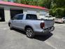 2018 Silver /Gray Honda Ridgeline RTL-E AWD (5FPYK3F79JB) with an 3.5L V6 SOHC 24V engine, Automatic transmission, located at 547 E. Main St., Orwell, OH, 44076, (440) 437-5893, 41.535435, -80.847855 - 2018 Honda Ridgeline RTL-E AWD – Premium Mid-Size Truck with Leather, Strong Towing, and Loaded Features! This sharp 2018 Honda Ridgeline RTL-E AWD is a refined and capable truck that combines car-like comfort with real truck utility. Powered by Honda’s smooth 3.5L Earth Dreams V6 engine paired - Photo#33