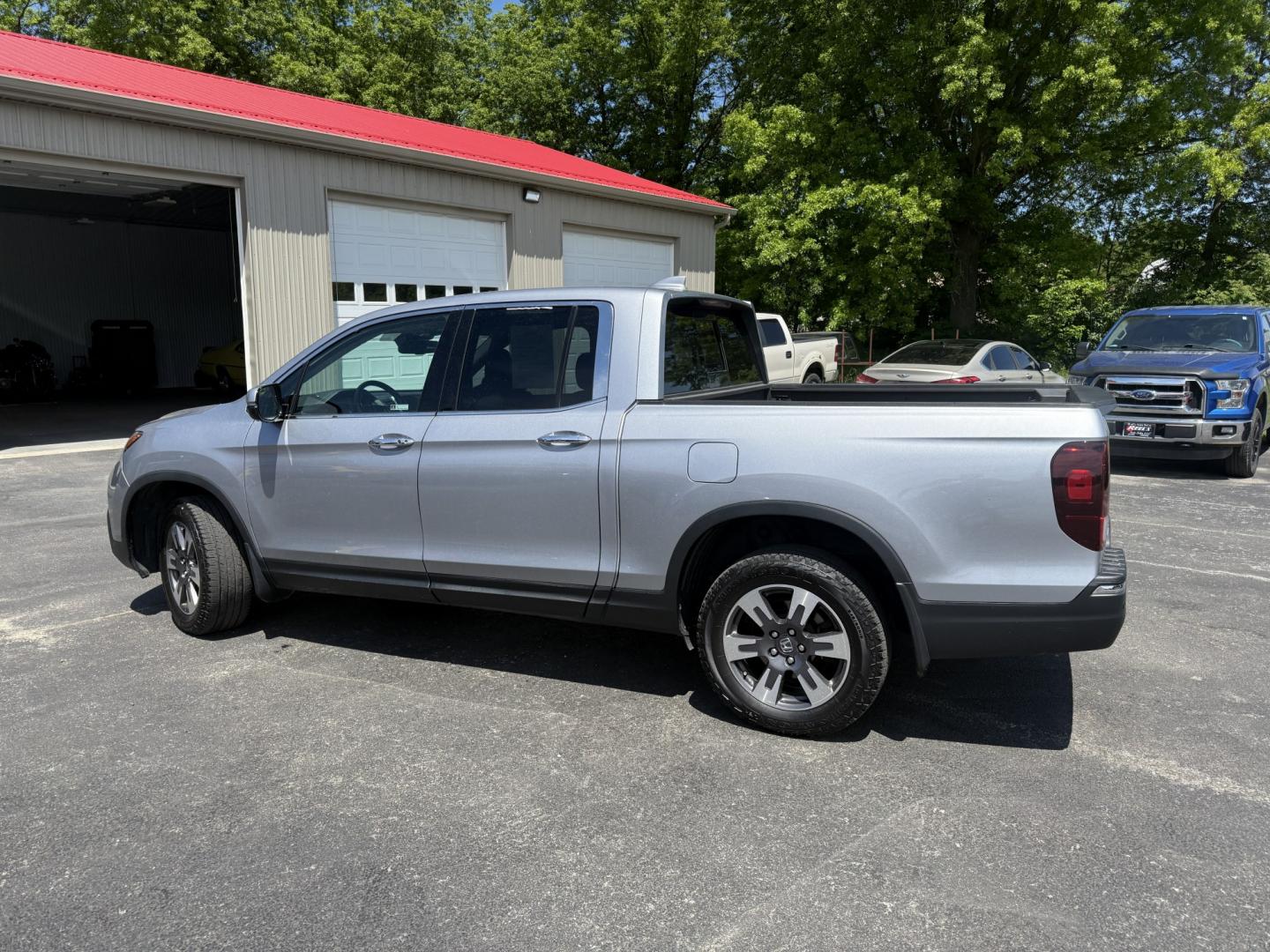 2018 Silver /Gray Honda Ridgeline RTL-E AWD (5FPYK3F79JB) with an 3.5L V6 SOHC 24V engine, Automatic transmission, located at 547 E. Main St., Orwell, OH, 44076, (440) 437-5893, 41.535435, -80.847855 - 2018 Honda Ridgeline RTL-E AWD – Premium Mid-Size Truck with Leather, Strong Towing, and Loaded Features! This sharp 2018 Honda Ridgeline RTL-E AWD is a refined and capable truck that combines car-like comfort with real truck utility. Powered by Honda’s smooth 3.5L Earth Dreams V6 engine paired - Photo#34