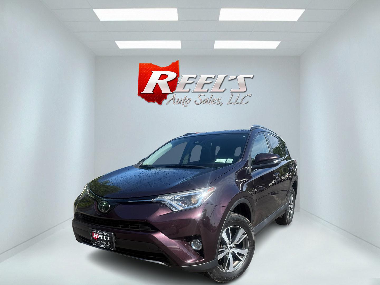2018 Purple /Black Toyota RAV4 XLE AWD (2T3RFREV6JW) with an 2.5L I4 DOHC 16V engine, Automatic transmission, located at 547 E. Main St., Orwell, OH, 44076, (440) 437-5893, 41.535435, -80.847855 - 2018 Toyota RAV4 XLE AWD – Reliable, Efficient, and Loaded with Safety and Convenience! This clean 2018 Toyota RAV4 XLE AWD is a smart, well-rounded compact SUV that offers excellent reliability, strong value, and everyday practicality. Powered by a smooth 2.5L I4 engine paired with a responsive - Photo#0