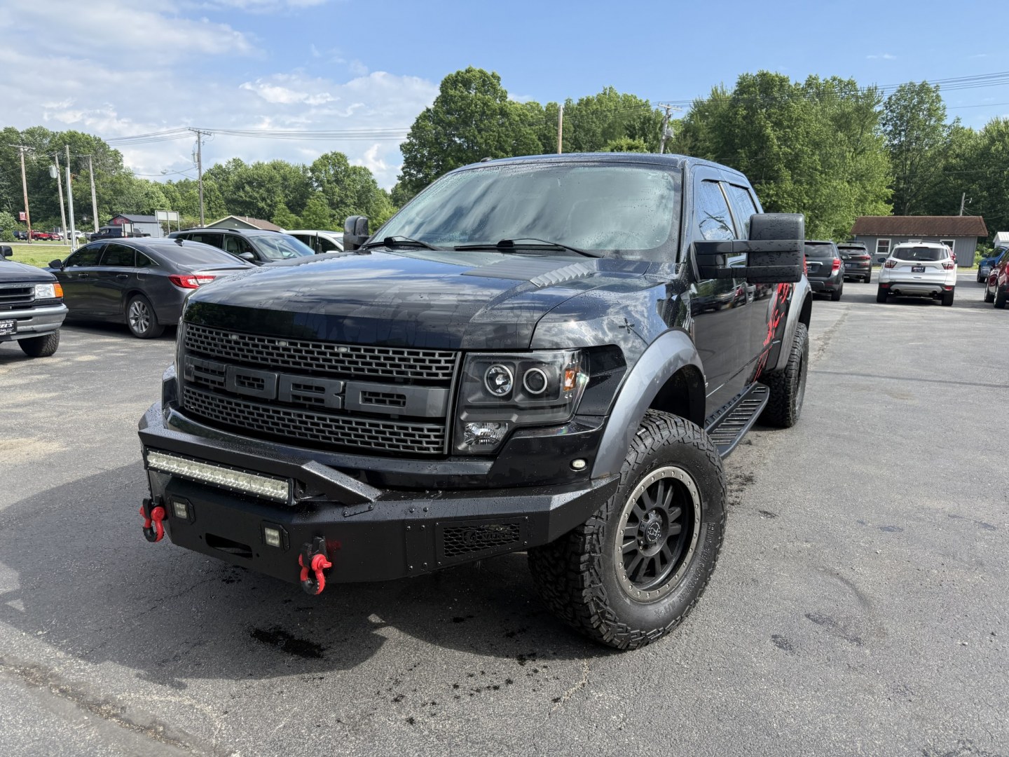 2011 Black /Black Ford F-150 SVT Raptor SuperCrew 5.5-ft. Bed 4WD (1FTFW1R6XBF) with an 6.2L V8 SOHC 16V engine, Automatic transmission, located at 547 E. Main St., Orwell, OH, 44076, (440) 437-5893, 41.535435, -80.847855 - 2011 Ford SVT Raptor Crew Cab 4WD – Iconic Off-Road Legend with 6.2L V8 Power! This 2011 Ford SVT Raptor Crew Cab 4WD is the original high-performance desert and trail truck that started the Raptor legacy. Powered by the massive 6.2L V8 engine paired with a smooth 6-speed automatic transmission, - Photo#0