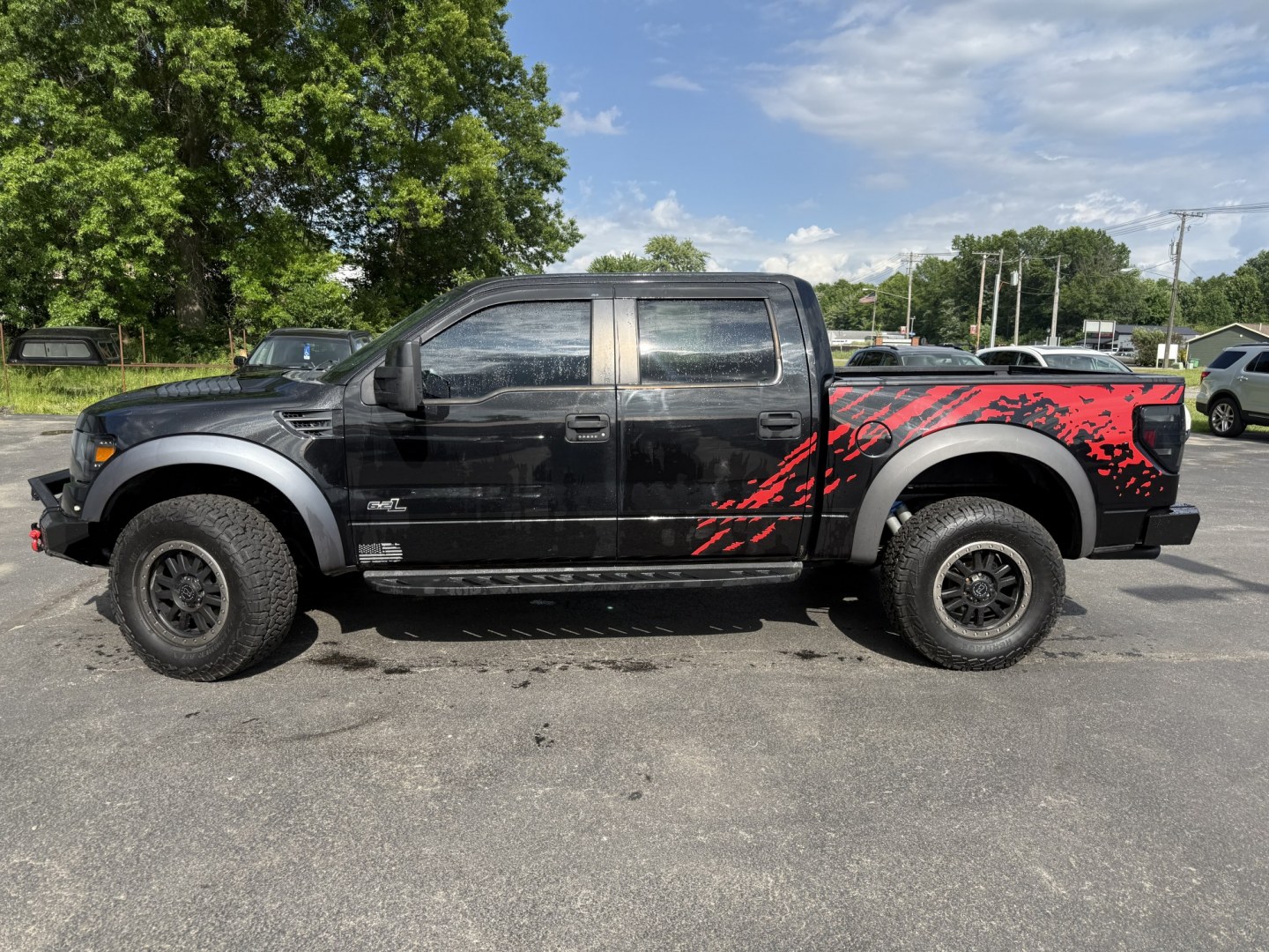 2011 Black /Black Ford F-150 SVT Raptor SuperCrew 5.5-ft. Bed 4WD (1FTFW1R6XBF) with an 6.2L V8 SOHC 16V engine, Automatic transmission, located at 547 E. Main St., Orwell, OH, 44076, (440) 437-5893, 41.535435, -80.847855 - 2011 Ford SVT Raptor Crew Cab 4WD – Iconic Off-Road Legend with 6.2L V8 Power! This 2011 Ford SVT Raptor Crew Cab 4WD is the original high-performance desert and trail truck that started the Raptor legacy. Powered by the massive 6.2L V8 engine paired with a smooth 6-speed automatic transmission, - Photo#32