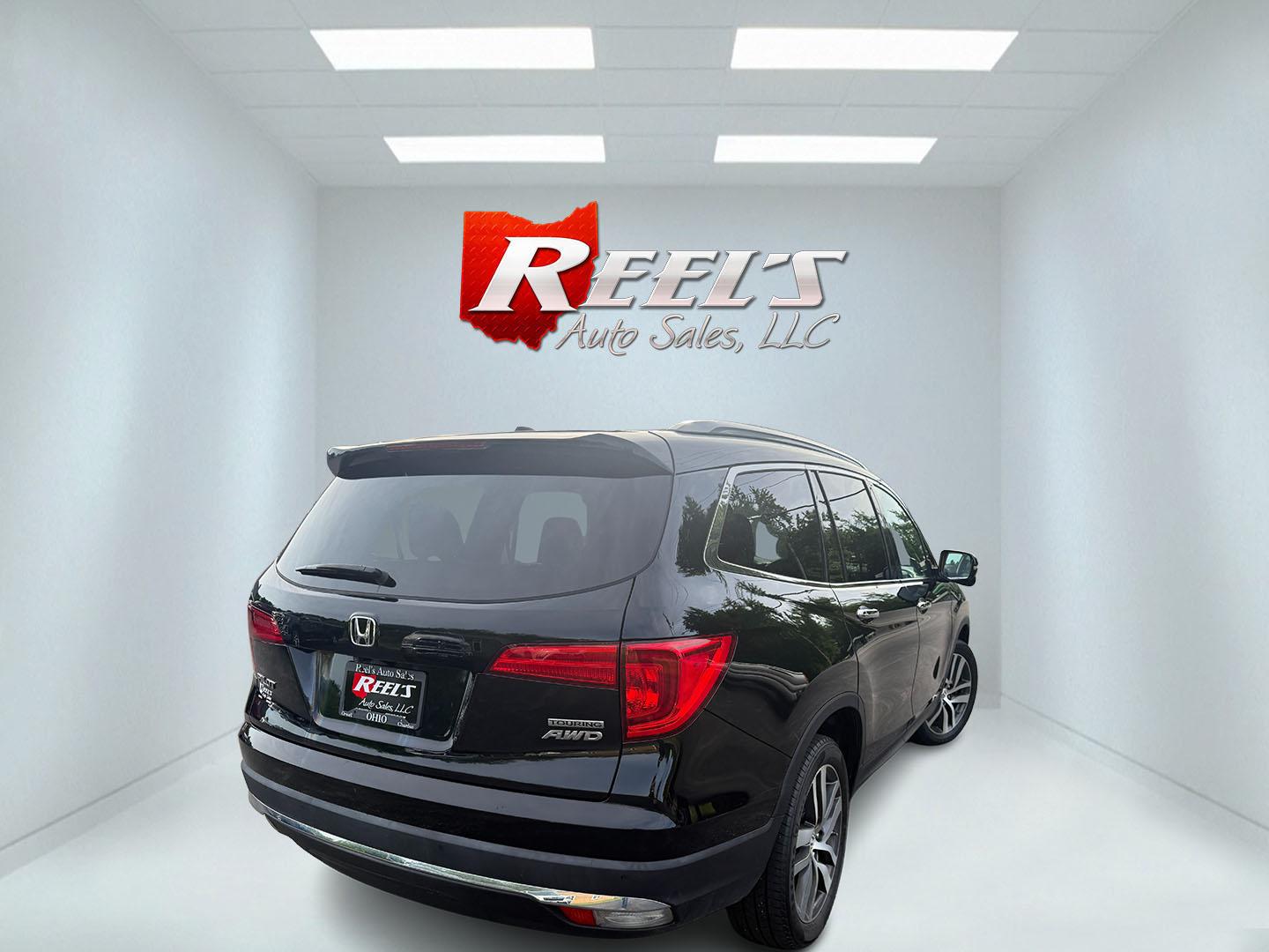 2018 Black /Black Honda Pilot Touring 4WD (5FNYF6H92JB) with an 3.5L V6 SOHC 24V engine, Automatic transmission, located at 547 E. Main St., Orwell, OH, 44076, (440) 437-5893, 41.535435, -80.847855 - 2018 Honda Pilot Touring AWD – Premium 3-Row Family SUV with Leather, Strong V6 Power, and Advanced Safety! This 2018 Honda Pilot Touring AWD is a loaded, upscale 3-row SUV that delivers the perfect combination of comfort, capability, and modern technology. Powered by Honda’s smooth 3.5L Earth- Photo#34