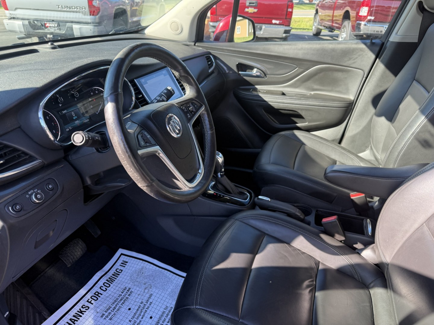 2017 Red /Black Buick Encore Essence FWD (KL4CJCSBXHB) with an 1.4L I4 DOHC 16V TURBO engine, Automatic transmission, located at 11115 Chardon Rd. , Chardon, OH, 44024, (440) 214-9705, 41.580246, -81.241943 - 2017 Buick Encore Essence FWD – Premium Compact Luxury with Leather, Heated Steering Wheel, and Excellent Efficiency! This sharp 2017 Buick Encore Essence FWD is a well-equipped upscale crossover that delivers a quiet, comfortable ride with modern features and strong fuel economy. Powered by a pe- Photo#6