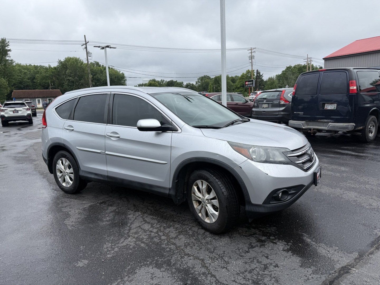 2014 Silver /Gray Honda CR-V EX-L 4WD 5-Speed AT (2HKRM4H71EH) with an 2.4L I4 DOHC 16V engine, Automatic transmission, located at 547 E. Main St., Orwell, OH, 44076, (440) 437-5893, 41.535435, -80.847855 - 2014 Honda CR-V EX-L 4WD – Premium Compact SUV with Fresh Service and Honda Reliability! This 2014 Honda CR-V EX-L 4WD is a clean, well-maintained compact SUV that offers upscale comfort and proven all-weather capability. Powered by a smooth 2.4L I4 engine paired with a durable 5-speed automatic- Photo#3