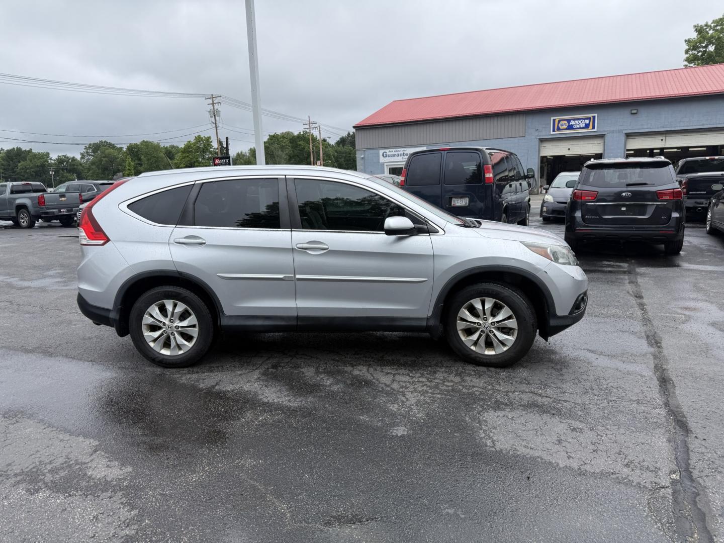 2014 Silver /Gray Honda CR-V EX-L 4WD 5-Speed AT (2HKRM4H71EH) with an 2.4L I4 DOHC 16V engine, Automatic transmission, located at 547 E. Main St., Orwell, OH, 44076, (440) 437-5893, 41.535435, -80.847855 - 2014 Honda CR-V EX-L 4WD – Premium Compact SUV with Fresh Service and Honda Reliability! This 2014 Honda CR-V EX-L 4WD is a clean, well-maintained compact SUV that offers upscale comfort and proven all-weather capability. Powered by a smooth 2.4L I4 engine paired with a durable 5-speed automatic- Photo#26