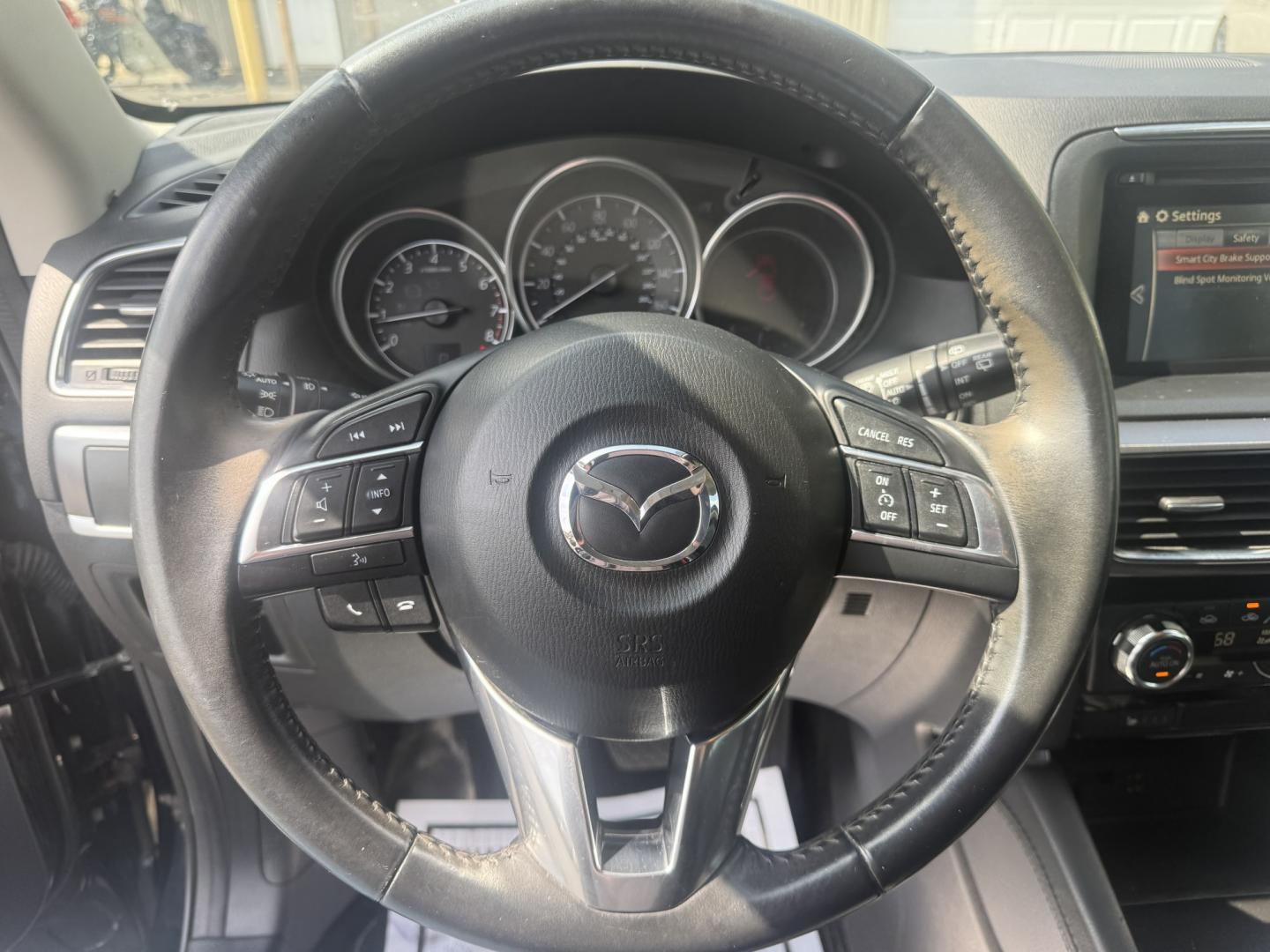 2016 Black /Black Mazda CX-5 Grand Touring AWD (JM3KE4DY6G0) with an 2.5L I4 DOHC 16V engine, Automatic transmission, located at 547 E. Main St., Orwell, OH, 44076, (440) 437-5893, 41.535435, -80.847855 - 2016 Mazda CX-5 Grand Touring AWD – Premium Compact SUV with Leather, BOSE Sound, and Strong Efficiency! This 2016 Mazda CX-5 Grand Touring AWD is a refined and sporty crossover that offers upscale comfort, engaging driving dynamics, and excellent efficiency. Powered by a smooth 2.5L I4 engine pa- Photo#13