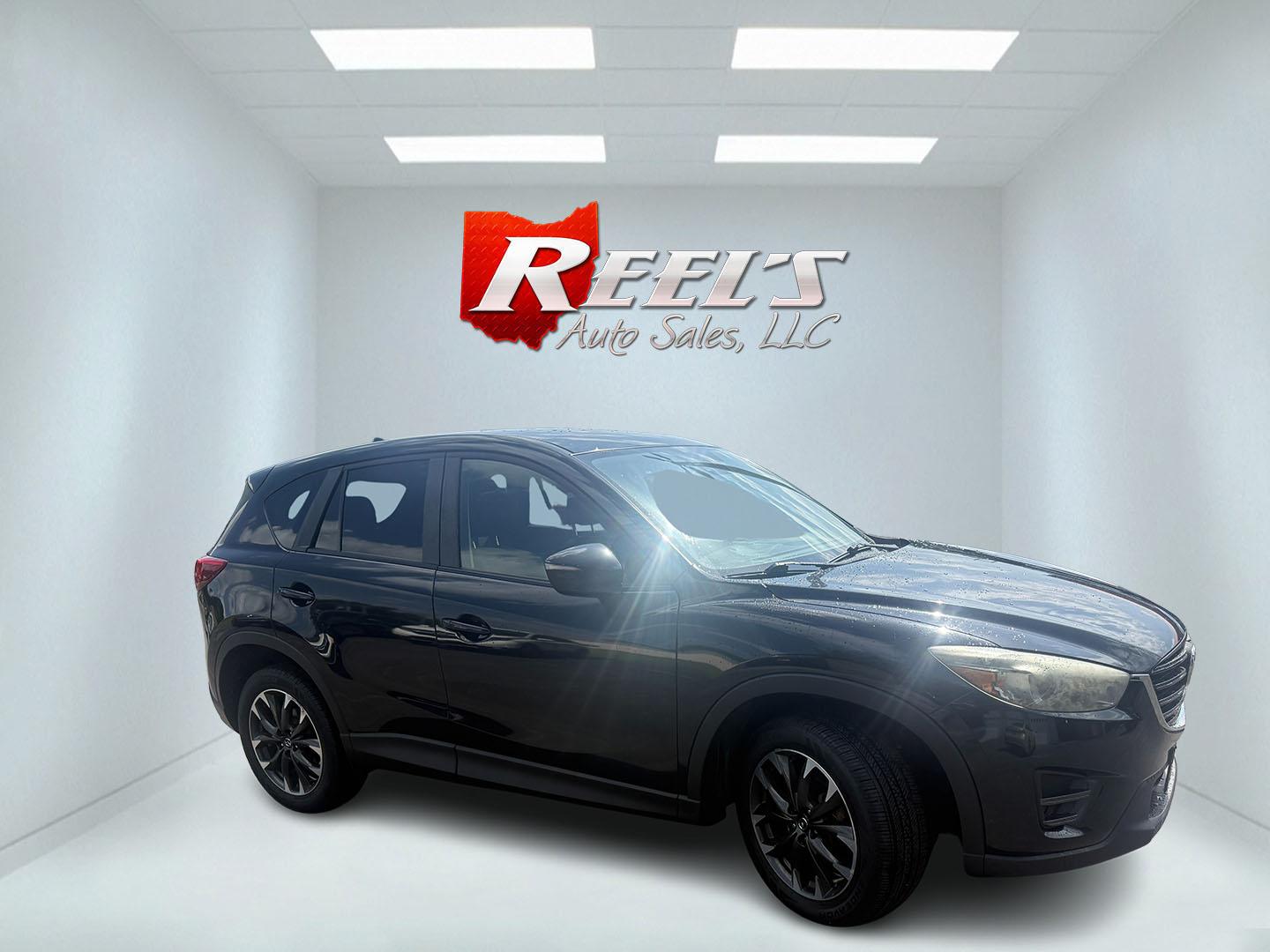 2016 Black /Black Mazda CX-5 Grand Touring AWD (JM3KE4DY6G0) with an 2.5L I4 DOHC 16V engine, Automatic transmission, located at 547 E. Main St., Orwell, OH, 44076, (440) 437-5893, 41.535435, -80.847855 - 2016 Mazda CX-5 Grand Touring AWD – Premium Compact SUV with Leather, BOSE Sound, and Strong Efficiency! This 2016 Mazda CX-5 Grand Touring AWD is a refined and sporty crossover that offers upscale comfort, engaging driving dynamics, and excellent efficiency. Powered by a smooth 2.5L I4 engine pa- Photo#3