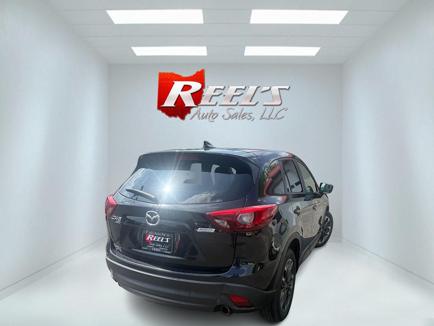 2016 Black /Black Mazda CX-5 Grand Touring AWD (JM3KE4DY6G0) with an 2.5L I4 DOHC 16V engine, Automatic transmission, located at 547 E. Main St., Orwell, OH, 44076, (440) 437-5893, 41.535435, -80.847855 - 2016 Mazda CX-5 Grand Touring AWD – Premium Compact SUV with Leather, BOSE Sound, and Strong Efficiency! This 2016 Mazda CX-5 Grand Touring AWD is a refined and sporty crossover that offers upscale comfort, engaging driving dynamics, and excellent efficiency. Powered by a smooth 2.5L I4 engine pa- Photo#28