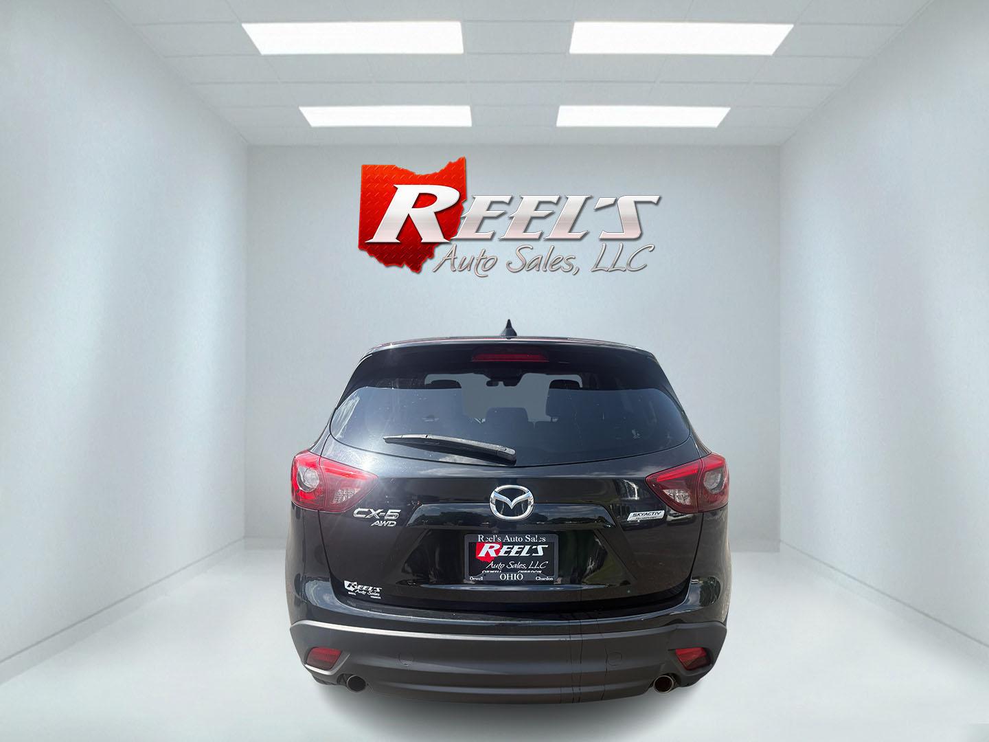 2016 Black /Black Mazda CX-5 Grand Touring AWD (JM3KE4DY6G0) with an 2.5L I4 DOHC 16V engine, Automatic transmission, located at 547 E. Main St., Orwell, OH, 44076, (440) 437-5893, 41.535435, -80.847855 - 2016 Mazda CX-5 Grand Touring AWD – Premium Compact SUV with Leather, BOSE Sound, and Strong Efficiency! This 2016 Mazda CX-5 Grand Touring AWD is a refined and sporty crossover that offers upscale comfort, engaging driving dynamics, and excellent efficiency. Powered by a smooth 2.5L I4 engine pa- Photo#29