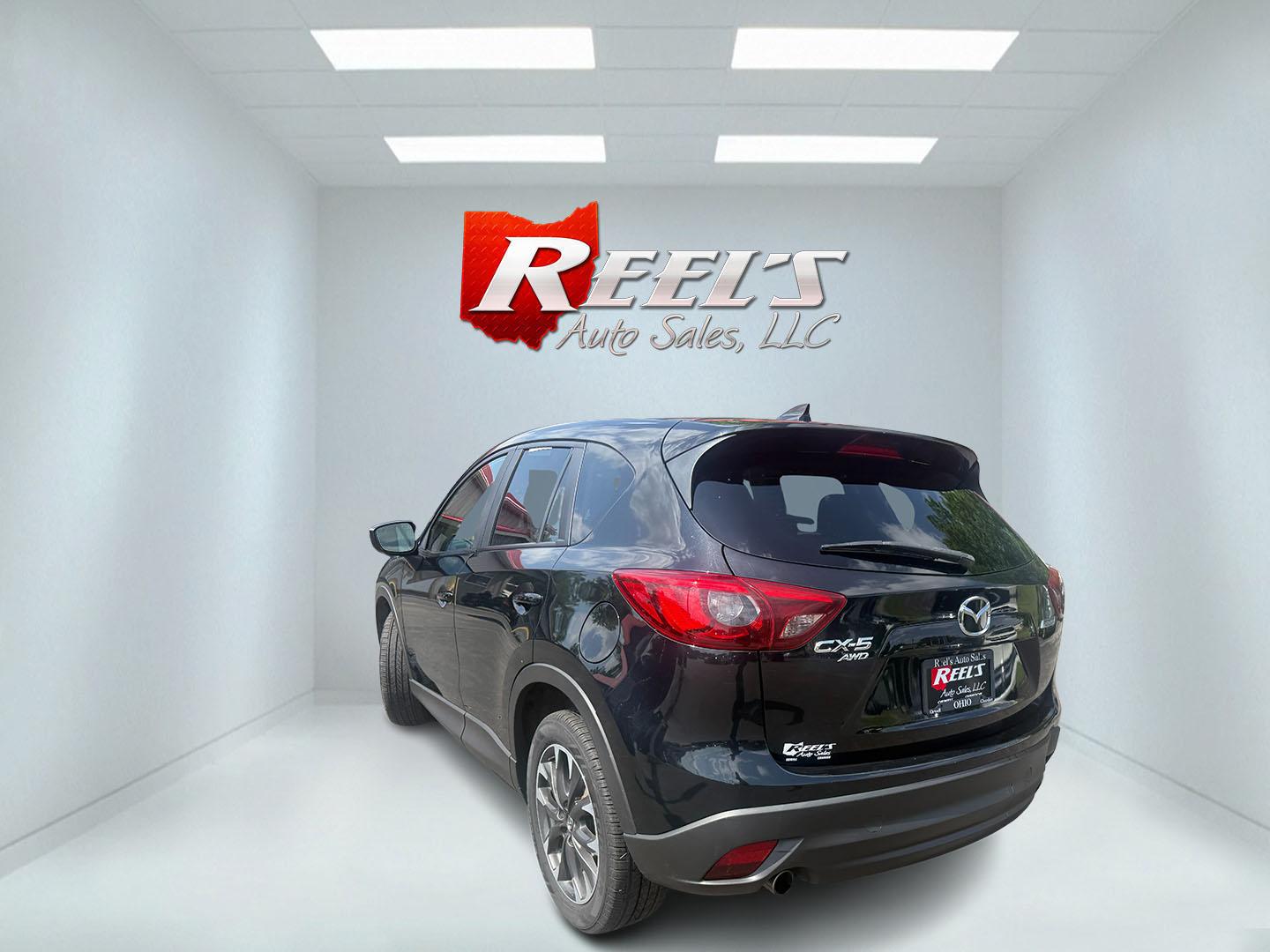 2016 Black /Black Mazda CX-5 Grand Touring AWD (JM3KE4DY6G0) with an 2.5L I4 DOHC 16V engine, Automatic transmission, located at 547 E. Main St., Orwell, OH, 44076, (440) 437-5893, 41.535435, -80.847855 - 2016 Mazda CX-5 Grand Touring AWD – Premium Compact SUV with Leather, BOSE Sound, and Strong Efficiency! This 2016 Mazda CX-5 Grand Touring AWD is a refined and sporty crossover that offers upscale comfort, engaging driving dynamics, and excellent efficiency. Powered by a smooth 2.5L I4 engine pa- Photo#30