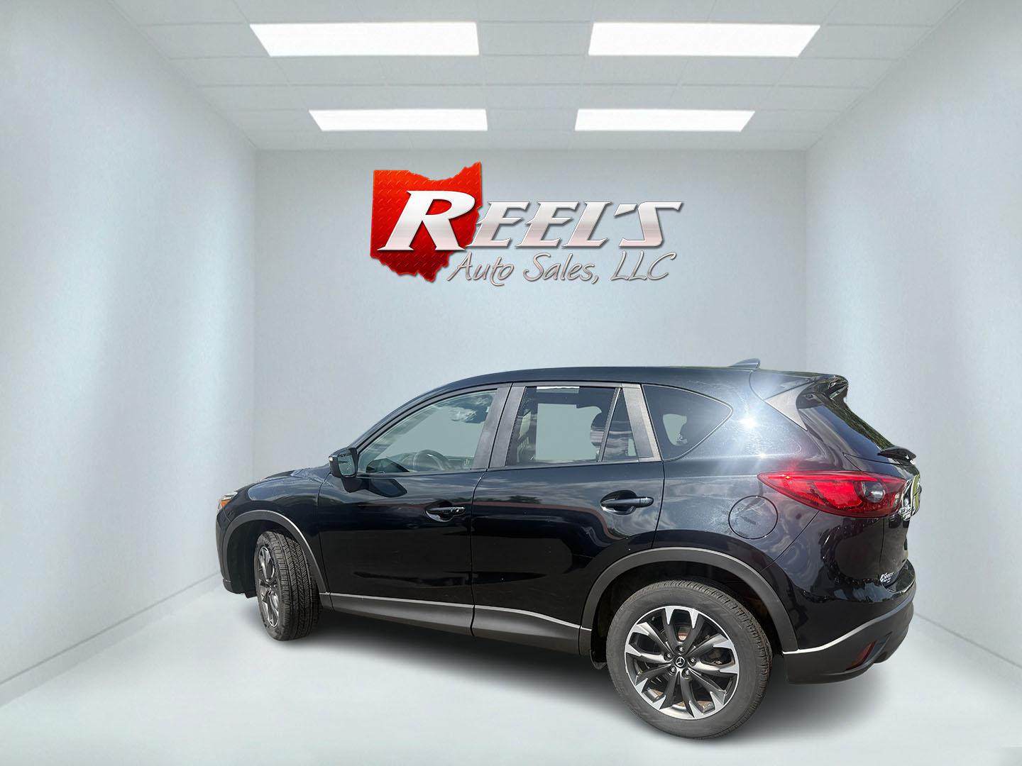 2016 Black /Black Mazda CX-5 Grand Touring AWD (JM3KE4DY6G0) with an 2.5L I4 DOHC 16V engine, Automatic transmission, located at 547 E. Main St., Orwell, OH, 44076, (440) 437-5893, 41.535435, -80.847855 - 2016 Mazda CX-5 Grand Touring AWD – Premium Compact SUV with Leather, BOSE Sound, and Strong Efficiency! This 2016 Mazda CX-5 Grand Touring AWD is a refined and sporty crossover that offers upscale comfort, engaging driving dynamics, and excellent efficiency. Powered by a smooth 2.5L I4 engine pa- Photo#31