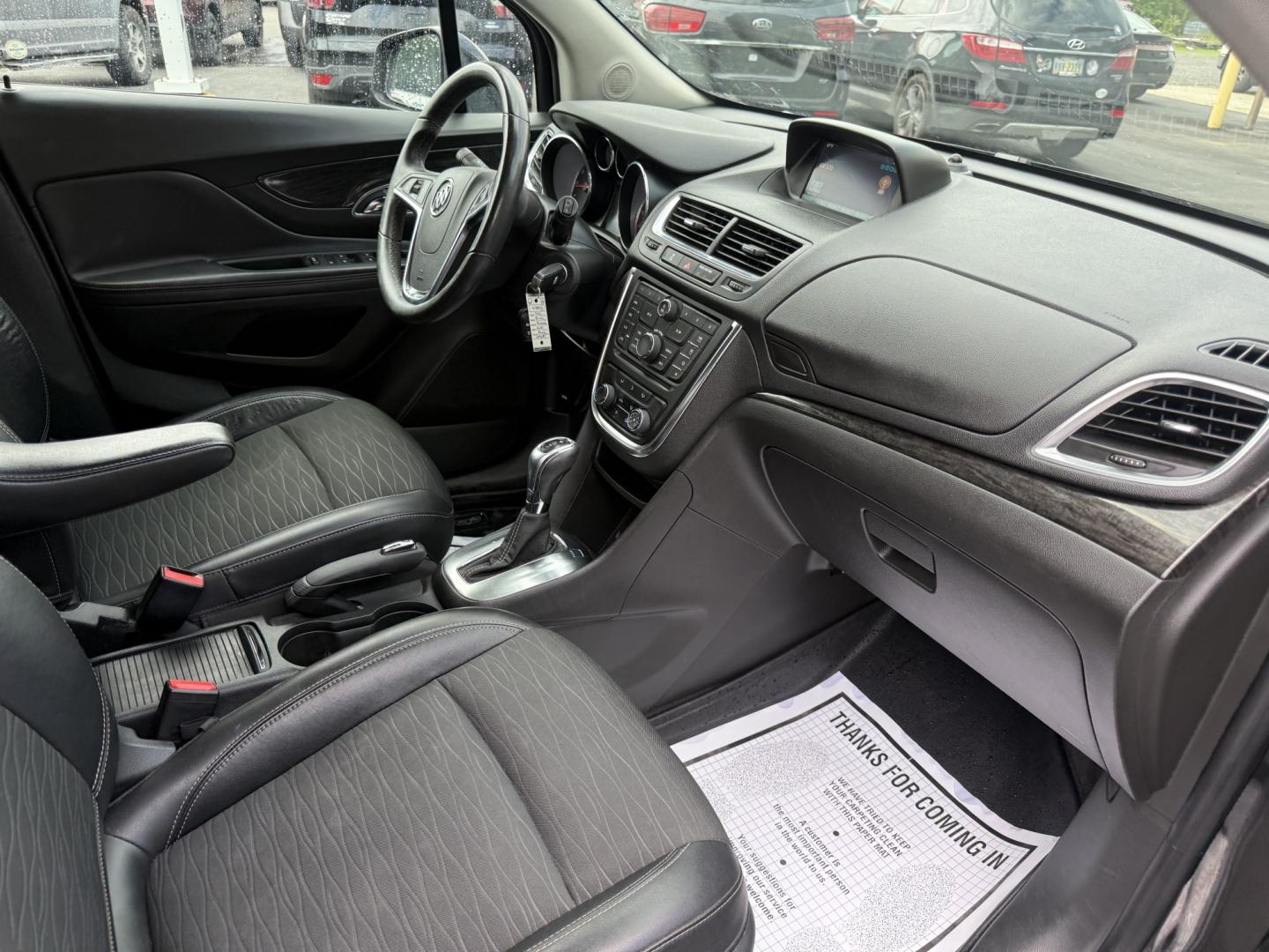 2016 Black /Black Buick Encore Base AWD (KL4CJESBXGB) with an 1.4L I4 DOHC 16V TURBO engine, Automatic transmission, located at 547 E. Main St., Orwell, OH, 44076, (440) 437-5893, 41.535435, -80.847855 - 2016 Buick Encore AWD – Compact Luxury with Turbo Efficiency and All-Weather Grip! This sharp 2016 Buick Encore AWD is a premium compact crossover that delivers refinement, comfort, and strong fuel economy in an easy-to-park size. Powered by a peppy 1.4L Turbocharged EcoTec I4 engine paired with- Photo#33