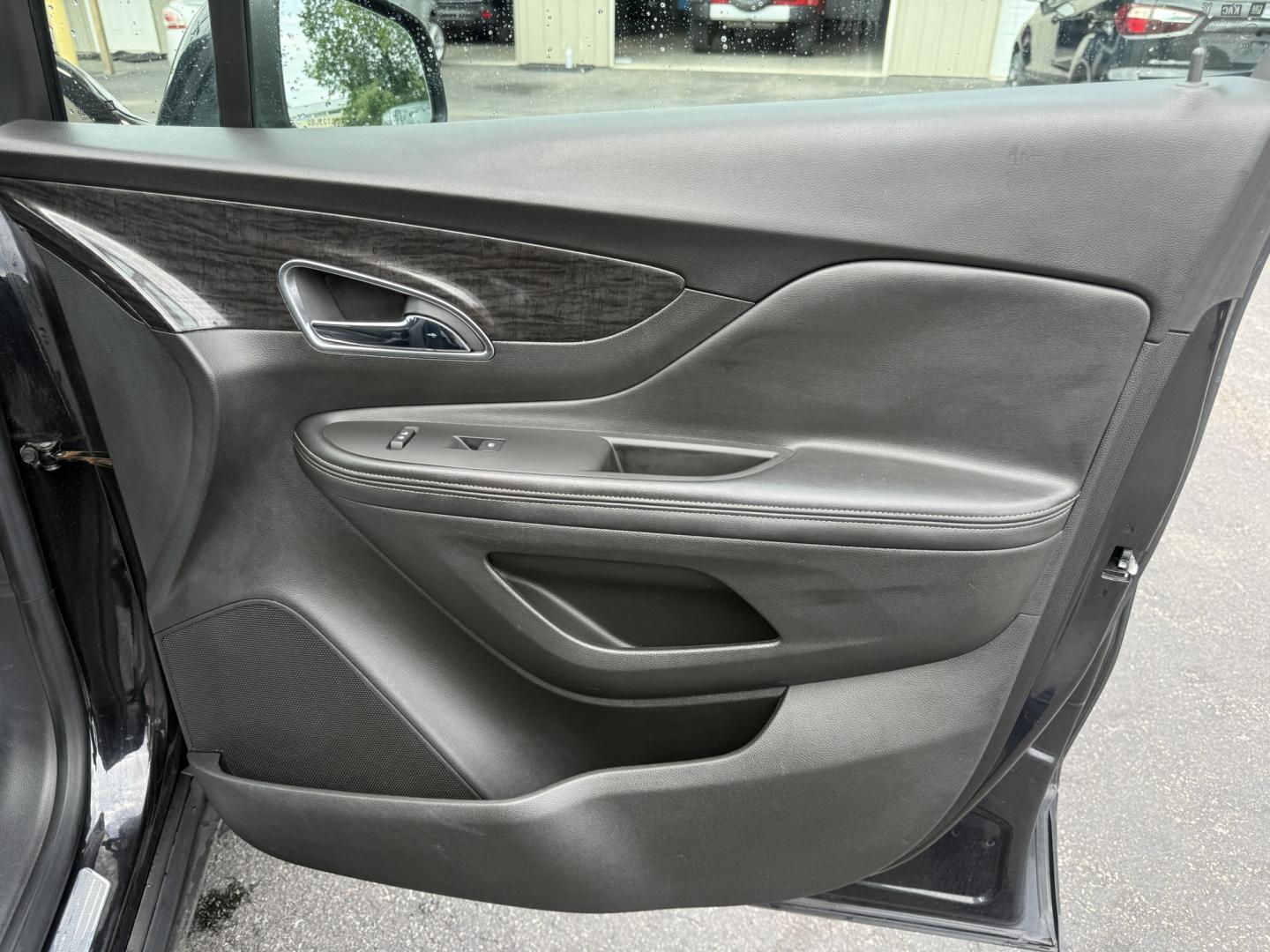 2016 Black /Black Buick Encore Base AWD (KL4CJESBXGB) with an 1.4L I4 DOHC 16V TURBO engine, Automatic transmission, located at 547 E. Main St., Orwell, OH, 44076, (440) 437-5893, 41.535435, -80.847855 - 2016 Buick Encore AWD – Compact Luxury with Turbo Efficiency and All-Weather Grip! This sharp 2016 Buick Encore AWD is a premium compact crossover that delivers refinement, comfort, and strong fuel economy in an easy-to-park size. Powered by a peppy 1.4L Turbocharged EcoTec I4 engine paired with- Photo#37