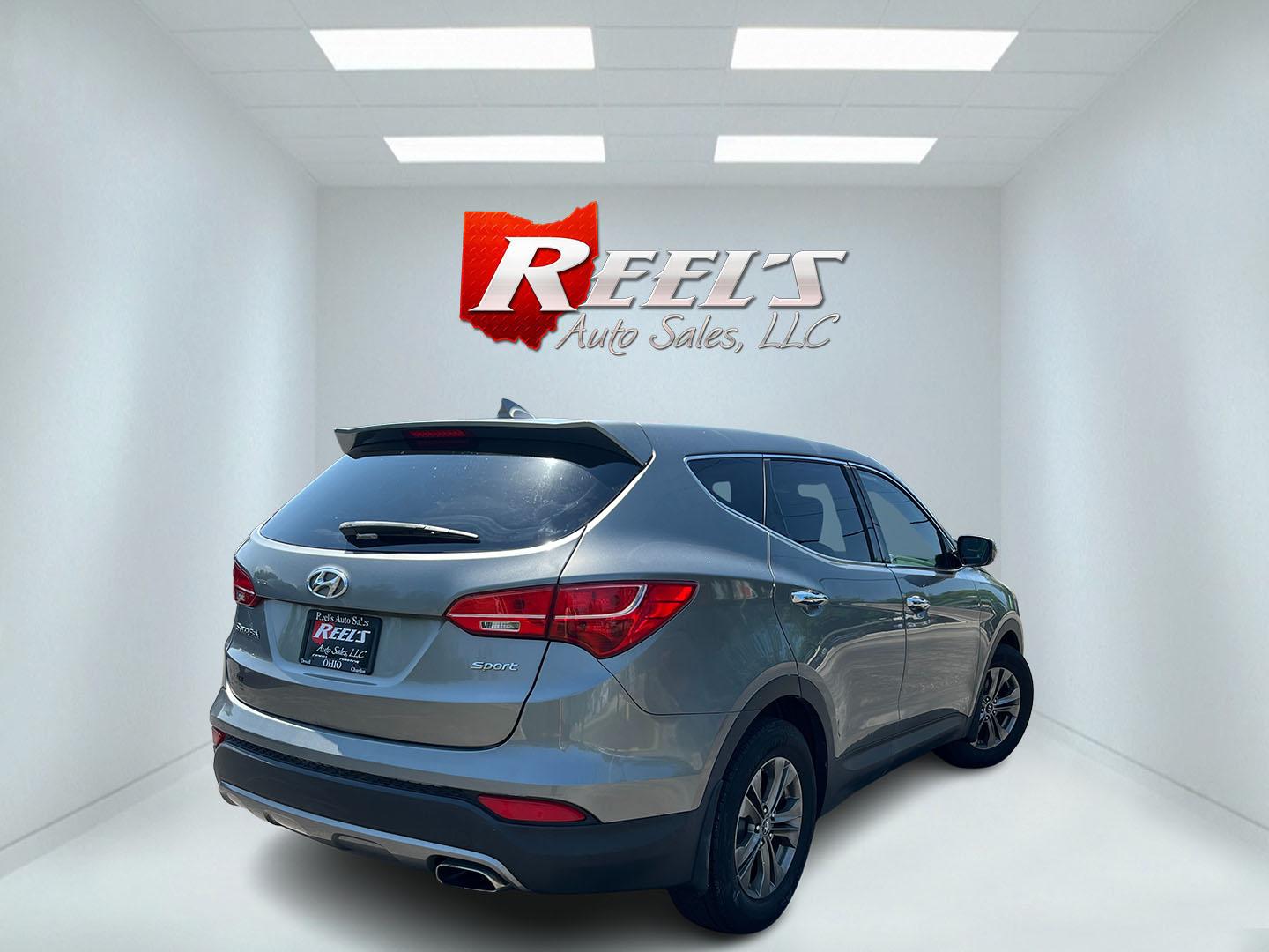 2013 Gray /Black Hyundai Santa Fe Sport 2.4 FWD (5XYZT3LB8DG) with an 2.4L I4 DOHC 16V engine, Automatic transmission, located at 11115 Chardon Rd. , Chardon, OH, 44024, (440) 214-9705, 41.580246, -81.241943 - 2013 Hyundai Santa Fe Sport FWD – Efficient, Versatile, and Ready for Daily Driving! This 2013 Hyundai Santa Fe Sport FWD is a practical and fuel-efficient compact crossover that offers great value and everyday usability. Powered by a responsive 2.4L GDI engine paired with a smooth 6-speed automa- Photo#6