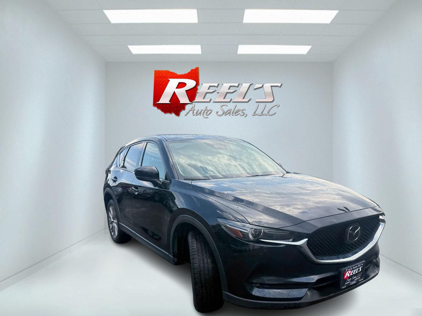 2019 Black /Black Mazda CX-5 Grand Touring AWD (JM3KFBDM2K0) with an 2.5L I4 DOHC 16V engine, Automatic transmission, located at 11115 Chardon Rd. , Chardon, OH, 44024, (440) 214-9705, 41.580246, -81.241943 - 2019 Mazda CX-5 Grand Touring AWD – Premium Compact SUV with Leather, BOSE Sound, and Sporty Dynamics! This 2019 Mazda CX-5 Grand Touring AWD is a refined and engaging compact crossover that offers upscale comfort and fun-to-drive performance. Powered by a smooth 2.5L I4 engine paired with a resp- Photo#3