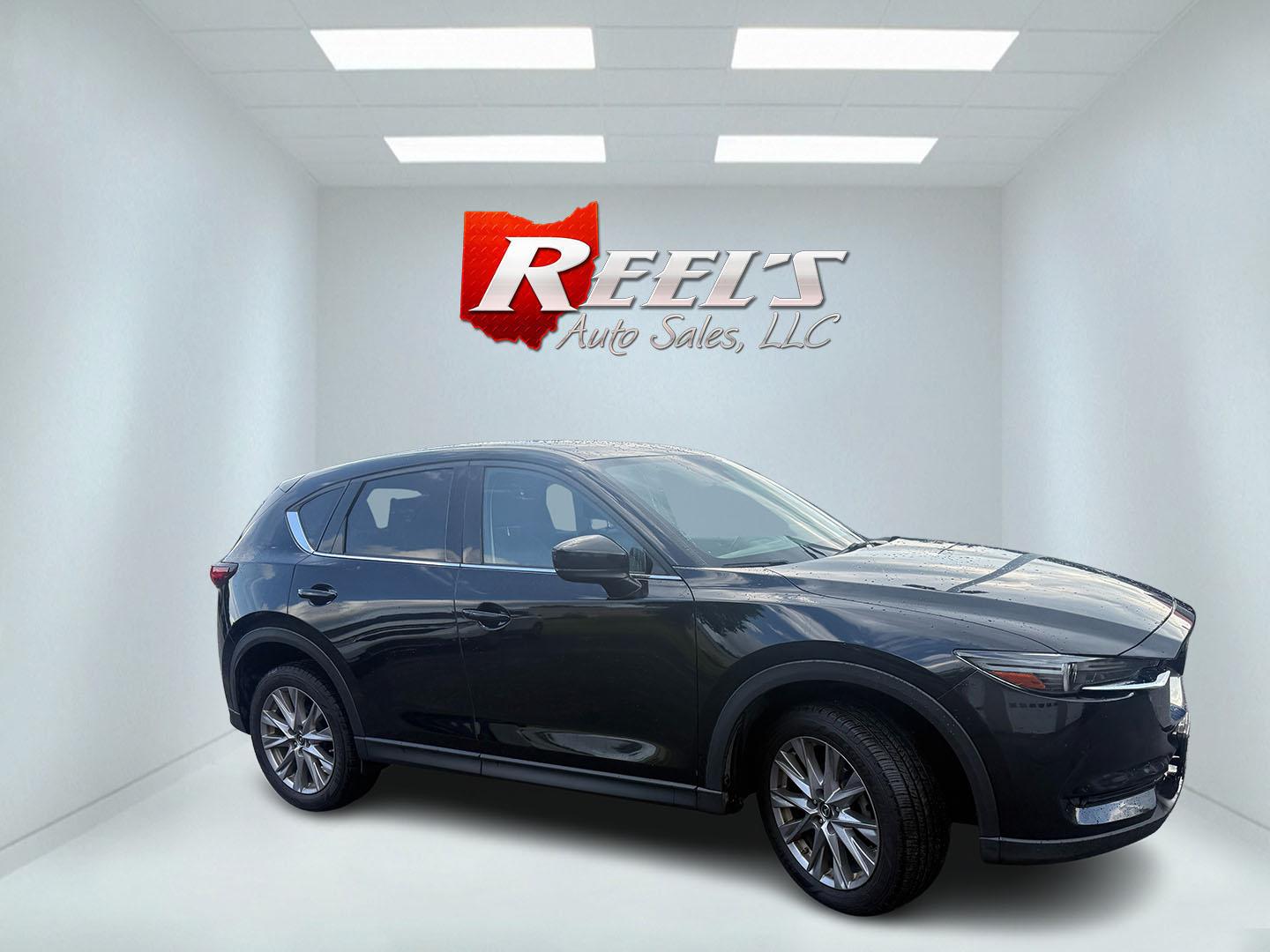2019 Black /Black Mazda CX-5 Grand Touring AWD (JM3KFBDM2K0) with an 2.5L I4 DOHC 16V engine, Automatic transmission, located at 11115 Chardon Rd. , Chardon, OH, 44024, (440) 214-9705, 41.580246, -81.241943 - 2019 Mazda CX-5 Grand Touring AWD – Premium Compact SUV with Leather, BOSE Sound, and Sporty Dynamics! This 2019 Mazda CX-5 Grand Touring AWD is a refined and engaging compact crossover that offers upscale comfort and fun-to-drive performance. Powered by a smooth 2.5L I4 engine paired with a resp- Photo#4
