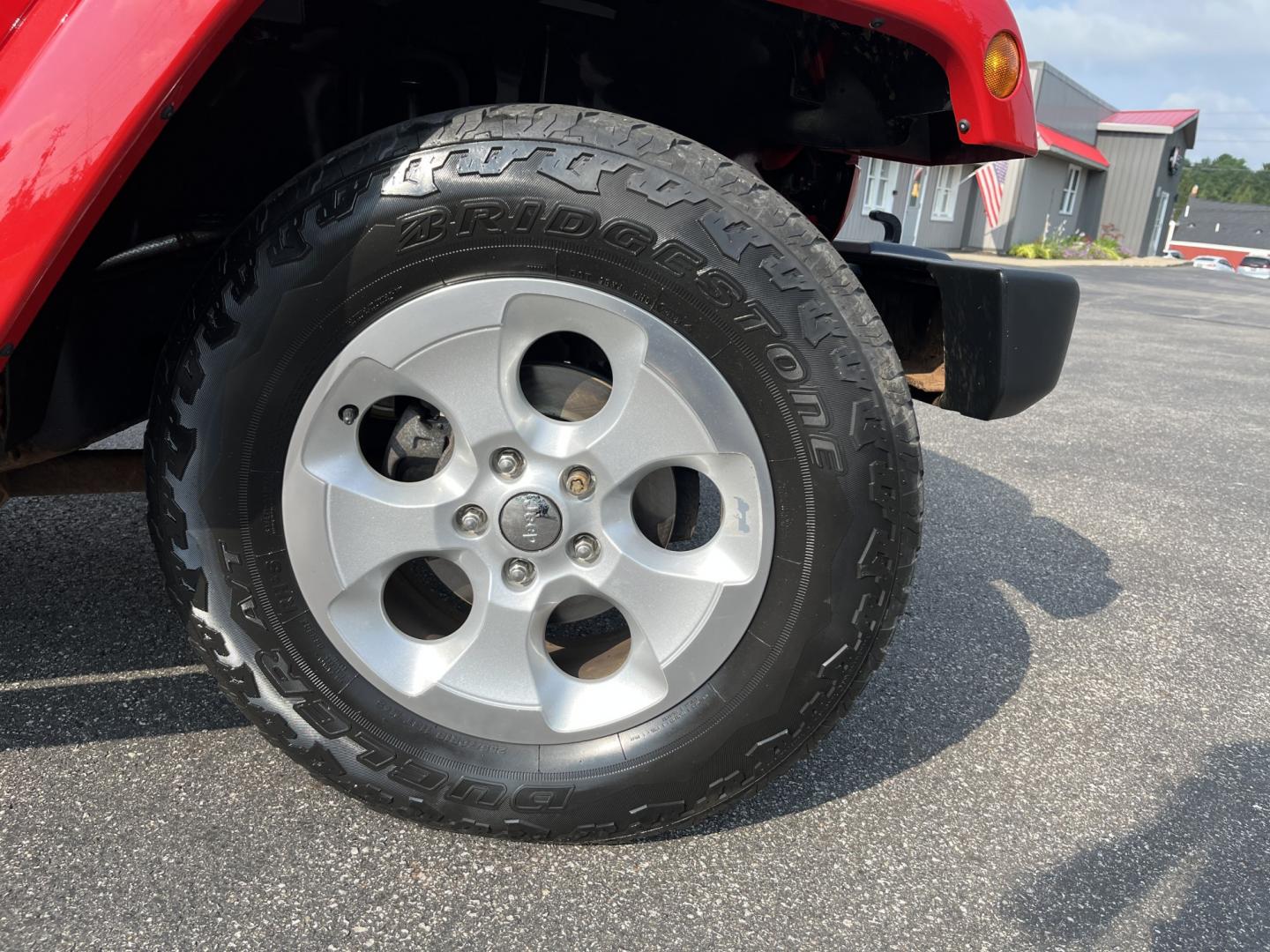 2014 Red /Black Jeep Wrangler Unlimited Sahara 4WD (1C4BJWEG7EL) with an 3.6L V6 DOHC 24V FFV engine, 5-Speed Automatic transmission, located at 547 E. Main St., Orwell, OH, 44076, (440) 437-5893, 41.535435, -80.847855 - 2014 Jeep Wrangler Unlimited Sahara 4WD – Flame Red with Trail Rated Capability and Classic Wrangler Style! This 2014 Jeep Wrangler Unlimited Sahara is a clean and capable 4-door ready for trails, daily driving, or weekend adventures. Powered by the reliable 3.6L Pentastar V6 engine paired with a- Photo#4