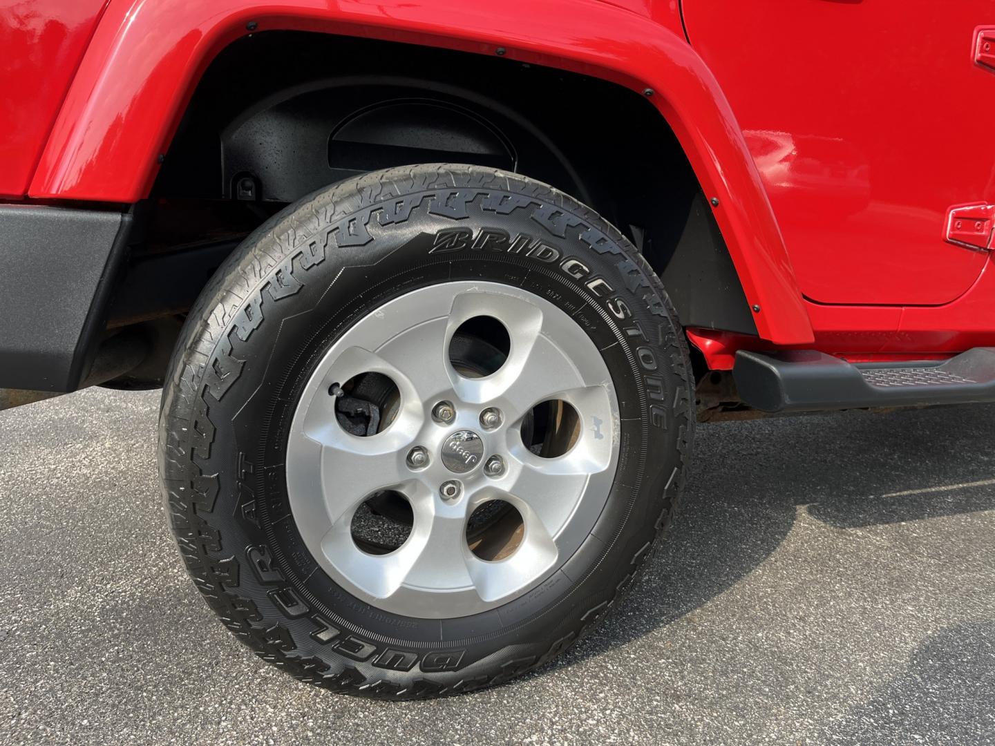 2014 Red /Black Jeep Wrangler Unlimited Sahara 4WD (1C4BJWEG7EL) with an 3.6L V6 DOHC 24V FFV engine, 5-Speed Automatic transmission, located at 547 E. Main St., Orwell, OH, 44076, (440) 437-5893, 41.535435, -80.847855 - 2014 Jeep Wrangler Unlimited Sahara 4WD – Flame Red with Trail Rated Capability and Classic Wrangler Style! This 2014 Jeep Wrangler Unlimited Sahara is a clean and capable 4-door ready for trails, daily driving, or weekend adventures. Powered by the reliable 3.6L Pentastar V6 engine paired with a- Photo#7