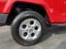 2014 Red /Black Jeep Wrangler Unlimited Sahara 4WD (1C4BJWEG7EL) with an 3.6L V6 DOHC 24V FFV engine, 5-Speed Automatic transmission, located at 547 E. Main St., Orwell, OH, 44076, (440) 437-5893, 41.535435, -80.847855 - 2014 Jeep Wrangler Unlimited Sahara 4WD – Flame Red with Trail Rated Capability and Classic Wrangler Style! This 2014 Jeep Wrangler Unlimited Sahara is a clean and capable 4-door ready for trails, daily driving, or weekend adventures. Powered by the reliable 3.6L Pentastar V6 engine paired with a- Photo#7