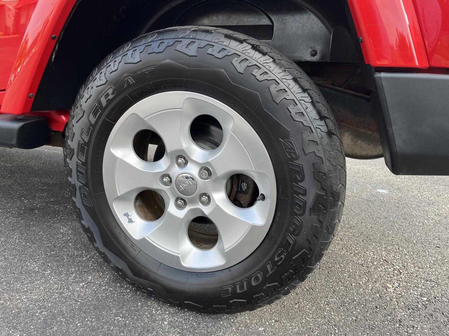 2014 Red /Black Jeep Wrangler Unlimited Sahara 4WD (1C4BJWEG7EL) with an 3.6L V6 DOHC 24V FFV engine, 5-Speed Automatic transmission, located at 547 E. Main St., Orwell, OH, 44076, (440) 437-5893, 41.535435, -80.847855 - 2014 Jeep Wrangler Unlimited Sahara 4WD – Flame Red with Trail Rated Capability and Classic Wrangler Style! This 2014 Jeep Wrangler Unlimited Sahara is a clean and capable 4-door ready for trails, daily driving, or weekend adventures. Powered by the reliable 3.6L Pentastar V6 engine paired with a- Photo#10