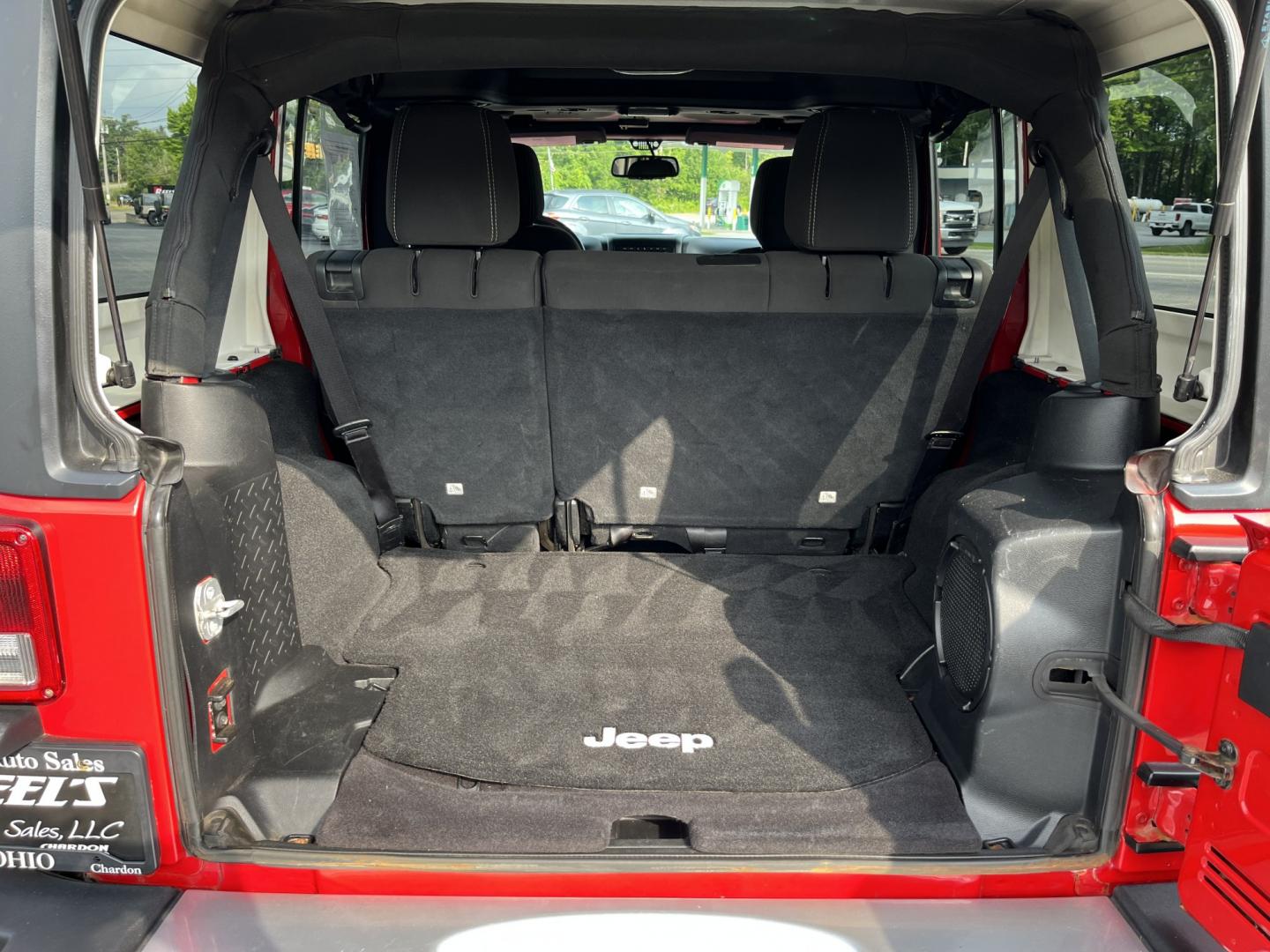 2014 Red /Black Jeep Wrangler Unlimited Sahara 4WD (1C4BJWEG7EL) with an 3.6L V6 DOHC 24V FFV engine, 5-Speed Automatic transmission, located at 547 E. Main St., Orwell, OH, 44076, (440) 437-5893, 41.535435, -80.847855 - 2014 Jeep Wrangler Unlimited Sahara 4WD – Flame Red with Trail Rated Capability and Classic Wrangler Style! This 2014 Jeep Wrangler Unlimited Sahara is a clean and capable 4-door ready for trails, daily driving, or weekend adventures. Powered by the reliable 3.6L Pentastar V6 engine paired with a- Photo#14