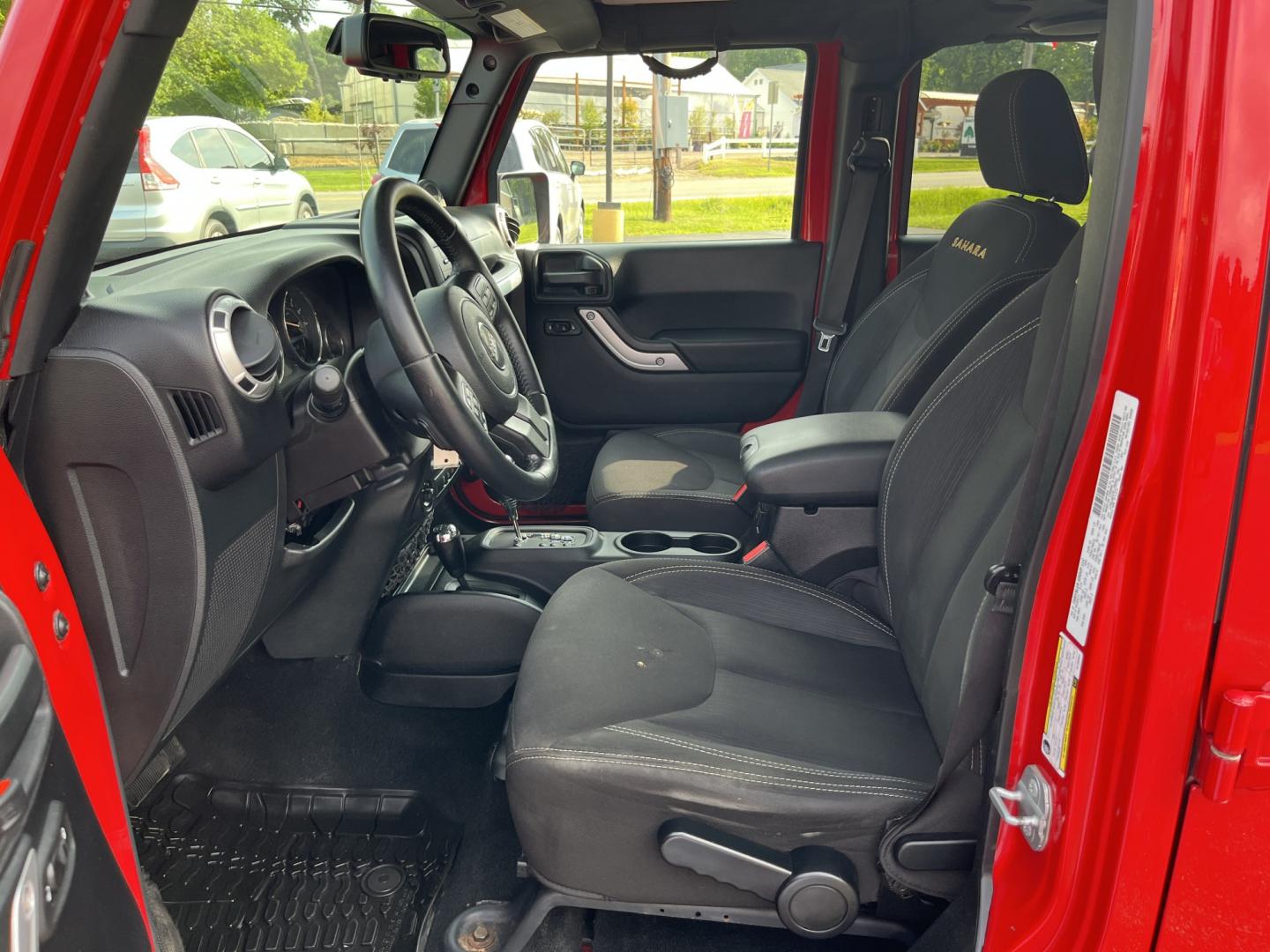 2014 Red /Black Jeep Wrangler Unlimited Sahara 4WD (1C4BJWEG7EL) with an 3.6L V6 DOHC 24V FFV engine, 5-Speed Automatic transmission, located at 547 E. Main St., Orwell, OH, 44076, (440) 437-5893, 41.535435, -80.847855 - 2014 Jeep Wrangler Unlimited Sahara 4WD – Flame Red with Trail Rated Capability and Classic Wrangler Style! This 2014 Jeep Wrangler Unlimited Sahara is a clean and capable 4-door ready for trails, daily driving, or weekend adventures. Powered by the reliable 3.6L Pentastar V6 engine paired with a- Photo#17