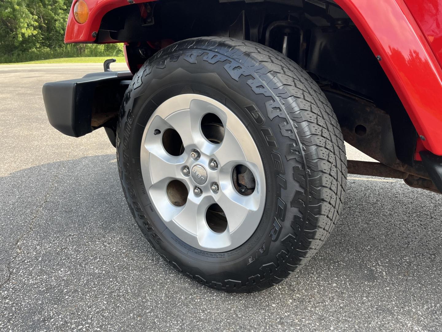 2014 Red /Black Jeep Wrangler Unlimited Sahara 4WD (1C4BJWEG7EL) with an 3.6L V6 DOHC 24V FFV engine, 5-Speed Automatic transmission, located at 547 E. Main St., Orwell, OH, 44076, (440) 437-5893, 41.535435, -80.847855 - 2014 Jeep Wrangler Unlimited Sahara 4WD – Flame Red with Trail Rated Capability and Classic Wrangler Style! This 2014 Jeep Wrangler Unlimited Sahara is a clean and capable 4-door ready for trails, daily driving, or weekend adventures. Powered by the reliable 3.6L Pentastar V6 engine paired with a- Photo#12