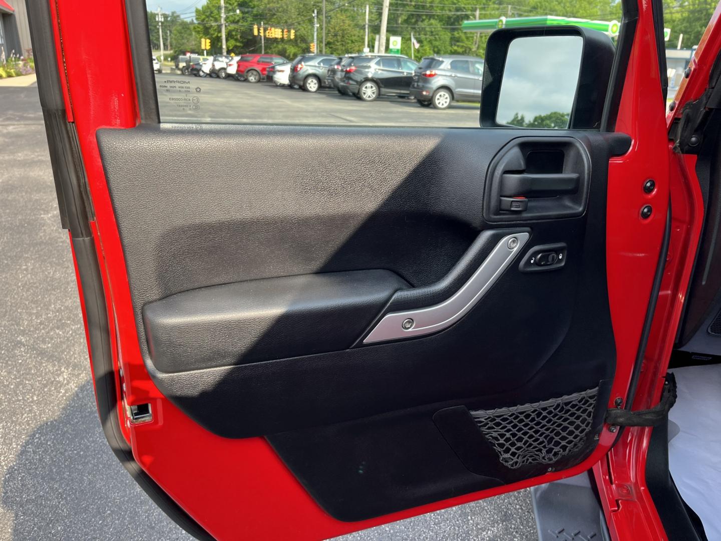 2014 Red /Black Jeep Wrangler Unlimited Sahara 4WD (1C4BJWEG7EL) with an 3.6L V6 DOHC 24V FFV engine, 5-Speed Automatic transmission, located at 547 E. Main St., Orwell, OH, 44076, (440) 437-5893, 41.535435, -80.847855 - 2014 Jeep Wrangler Unlimited Sahara 4WD – Flame Red with Trail Rated Capability and Classic Wrangler Style! This 2014 Jeep Wrangler Unlimited Sahara is a clean and capable 4-door ready for trails, daily driving, or weekend adventures. Powered by the reliable 3.6L Pentastar V6 engine paired with a- Photo#15
