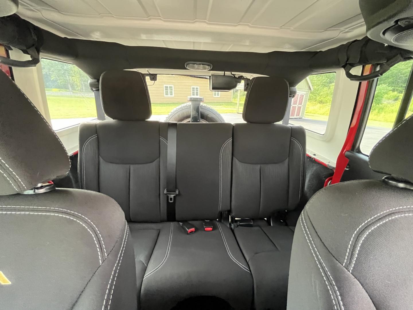 2014 Red /Black Jeep Wrangler Unlimited Sahara 4WD (1C4BJWEG7EL) with an 3.6L V6 DOHC 24V FFV engine, 5-Speed Automatic transmission, located at 547 E. Main St., Orwell, OH, 44076, (440) 437-5893, 41.535435, -80.847855 - 2014 Jeep Wrangler Unlimited Sahara 4WD – Flame Red with Trail Rated Capability and Classic Wrangler Style! This 2014 Jeep Wrangler Unlimited Sahara is a clean and capable 4-door ready for trails, daily driving, or weekend adventures. Powered by the reliable 3.6L Pentastar V6 engine paired with a- Photo#28