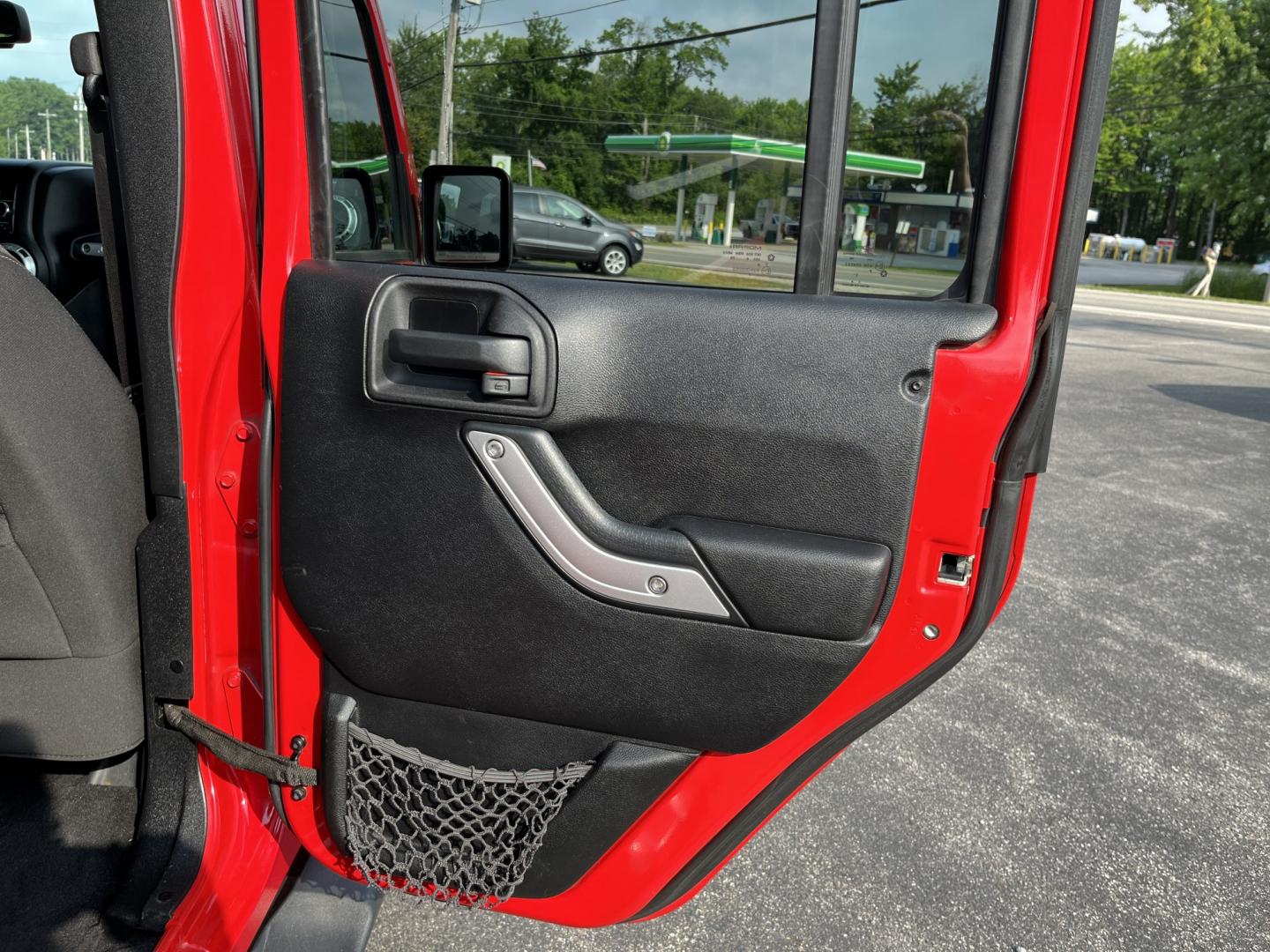2014 Red /Black Jeep Wrangler Unlimited Sahara 4WD (1C4BJWEG7EL) with an 3.6L V6 DOHC 24V FFV engine, 5-Speed Automatic transmission, located at 547 E. Main St., Orwell, OH, 44076, (440) 437-5893, 41.535435, -80.847855 - 2014 Jeep Wrangler Unlimited Sahara 4WD – Flame Red with Trail Rated Capability and Classic Wrangler Style! This 2014 Jeep Wrangler Unlimited Sahara is a clean and capable 4-door ready for trails, daily driving, or weekend adventures. Powered by the reliable 3.6L Pentastar V6 engine paired with a- Photo#32