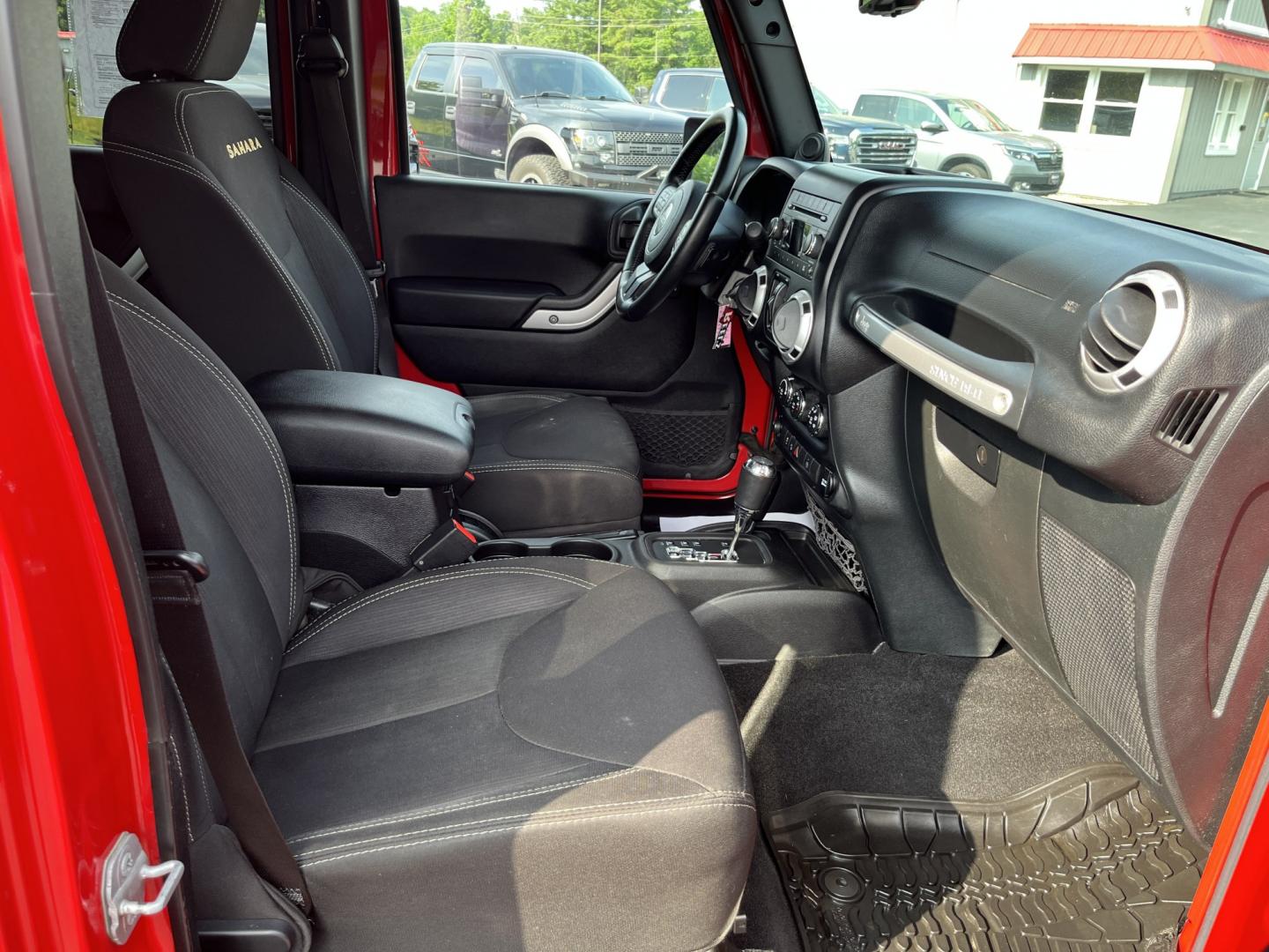 2014 Red /Black Jeep Wrangler Unlimited Sahara 4WD (1C4BJWEG7EL) with an 3.6L V6 DOHC 24V FFV engine, 5-Speed Automatic transmission, located at 547 E. Main St., Orwell, OH, 44076, (440) 437-5893, 41.535435, -80.847855 - 2014 Jeep Wrangler Unlimited Sahara 4WD – Flame Red with Trail Rated Capability and Classic Wrangler Style! This 2014 Jeep Wrangler Unlimited Sahara is a clean and capable 4-door ready for trails, daily driving, or weekend adventures. Powered by the reliable 3.6L Pentastar V6 engine paired with a- Photo#35