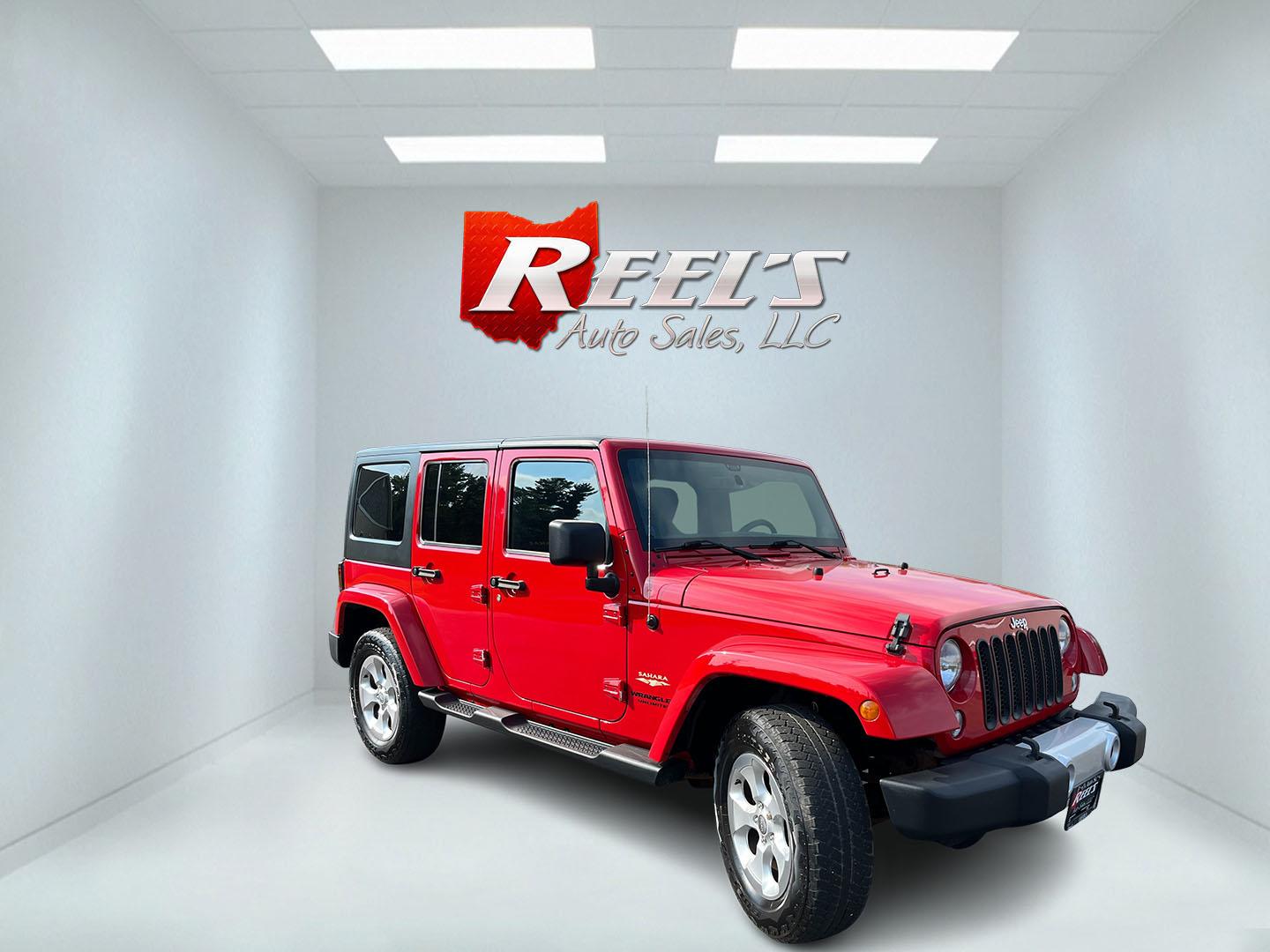 2014 Red /Black Jeep Wrangler Unlimited Sahara 4WD (1C4BJWEG7EL) with an 3.6L V6 DOHC 24V FFV engine, 5-Speed Automatic transmission, located at 547 E. Main St., Orwell, OH, 44076, (440) 437-5893, 41.535435, -80.847855 - 2014 Jeep Wrangler Unlimited Sahara 4WD – Flame Red with Trail Rated Capability and Classic Wrangler Style! This 2014 Jeep Wrangler Unlimited Sahara is a clean and capable 4-door ready for trails, daily driving, or weekend adventures. Powered by the reliable 3.6L Pentastar V6 engine paired with a- Photo#2