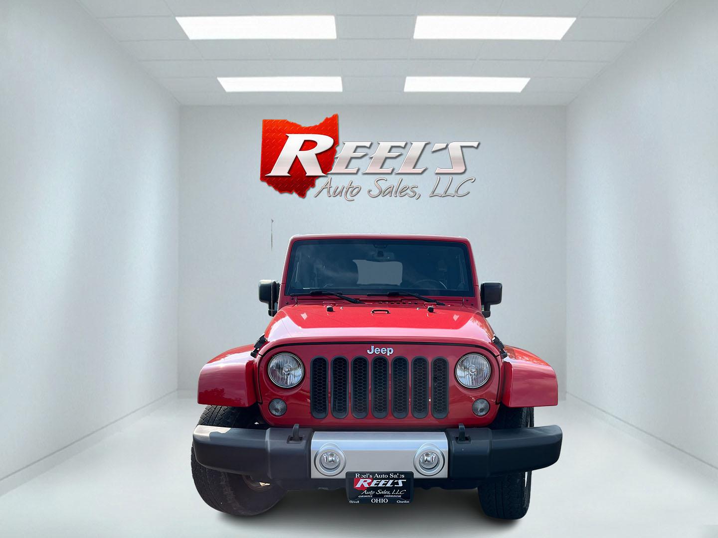 2014 Red /Black Jeep Wrangler Unlimited Sahara 4WD (1C4BJWEG7EL) with an 3.6L V6 DOHC 24V FFV engine, 5-Speed Automatic transmission, located at 547 E. Main St., Orwell, OH, 44076, (440) 437-5893, 41.535435, -80.847855 - 2014 Jeep Wrangler Unlimited Sahara 4WD – Flame Red with Trail Rated Capability and Classic Wrangler Style! This 2014 Jeep Wrangler Unlimited Sahara is a clean and capable 4-door ready for trails, daily driving, or weekend adventures. Powered by the reliable 3.6L Pentastar V6 engine paired with a- Photo#1