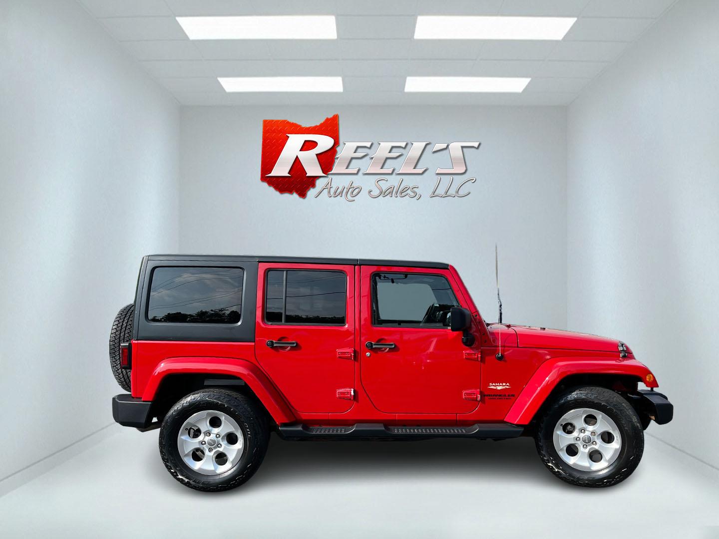 2014 Red /Black Jeep Wrangler Unlimited Sahara 4WD (1C4BJWEG7EL) with an 3.6L V6 DOHC 24V FFV engine, 5-Speed Automatic transmission, located at 547 E. Main St., Orwell, OH, 44076, (440) 437-5893, 41.535435, -80.847855 - 2014 Jeep Wrangler Unlimited Sahara 4WD – Flame Red with Trail Rated Capability and Classic Wrangler Style! This 2014 Jeep Wrangler Unlimited Sahara is a clean and capable 4-door ready for trails, daily driving, or weekend adventures. Powered by the reliable 3.6L Pentastar V6 engine paired with a- Photo#5