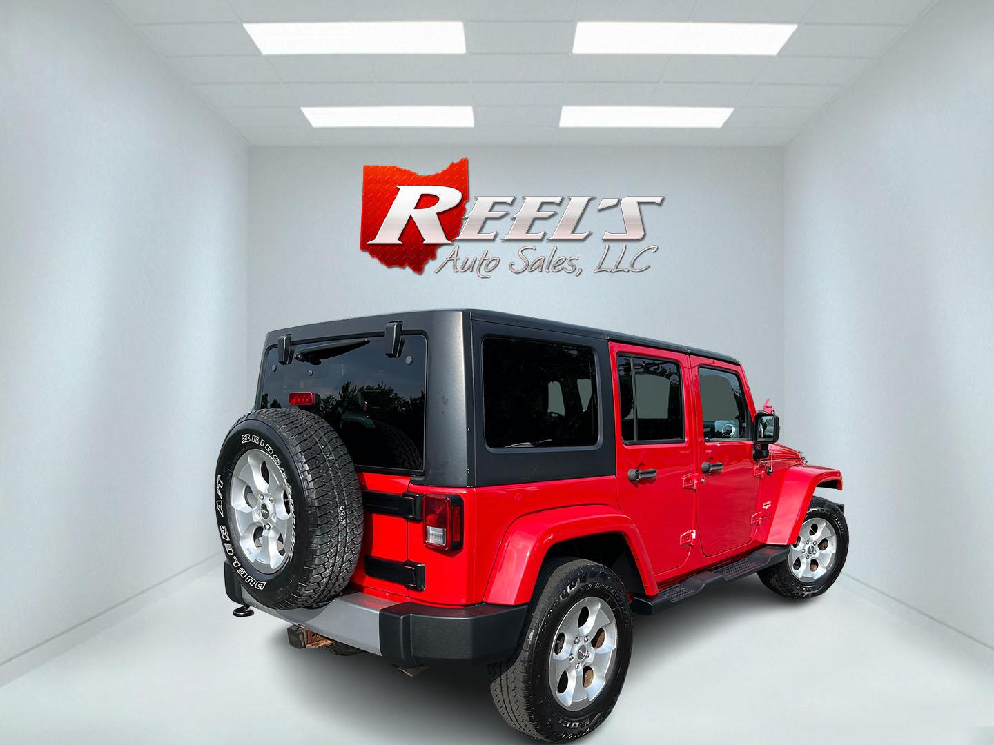 2014 Red /Black Jeep Wrangler Unlimited Sahara 4WD (1C4BJWEG7EL) with an 3.6L V6 DOHC 24V FFV engine, 5-Speed Automatic transmission, located at 547 E. Main St., Orwell, OH, 44076, (440) 437-5893, 41.535435, -80.847855 - 2014 Jeep Wrangler Unlimited Sahara 4WD – Flame Red with Trail Rated Capability and Classic Wrangler Style! This 2014 Jeep Wrangler Unlimited Sahara is a clean and capable 4-door ready for trails, daily driving, or weekend adventures. Powered by the reliable 3.6L Pentastar V6 engine paired with a- Photo#6