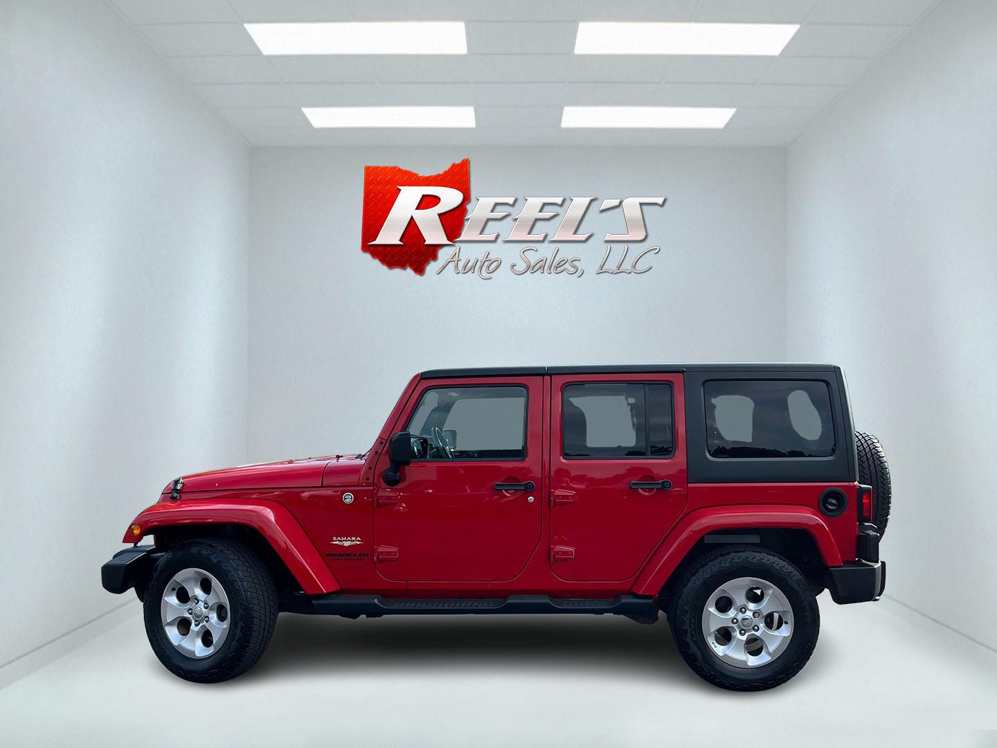 2014 Red /Black Jeep Wrangler Unlimited Sahara 4WD (1C4BJWEG7EL) with an 3.6L V6 DOHC 24V FFV engine, 5-Speed Automatic transmission, located at 547 E. Main St., Orwell, OH, 44076, (440) 437-5893, 41.535435, -80.847855 - 2014 Jeep Wrangler Unlimited Sahara 4WD – Flame Red with Trail Rated Capability and Classic Wrangler Style! This 2014 Jeep Wrangler Unlimited Sahara is a clean and capable 4-door ready for trails, daily driving, or weekend adventures. Powered by the reliable 3.6L Pentastar V6 engine paired with a- Photo#11