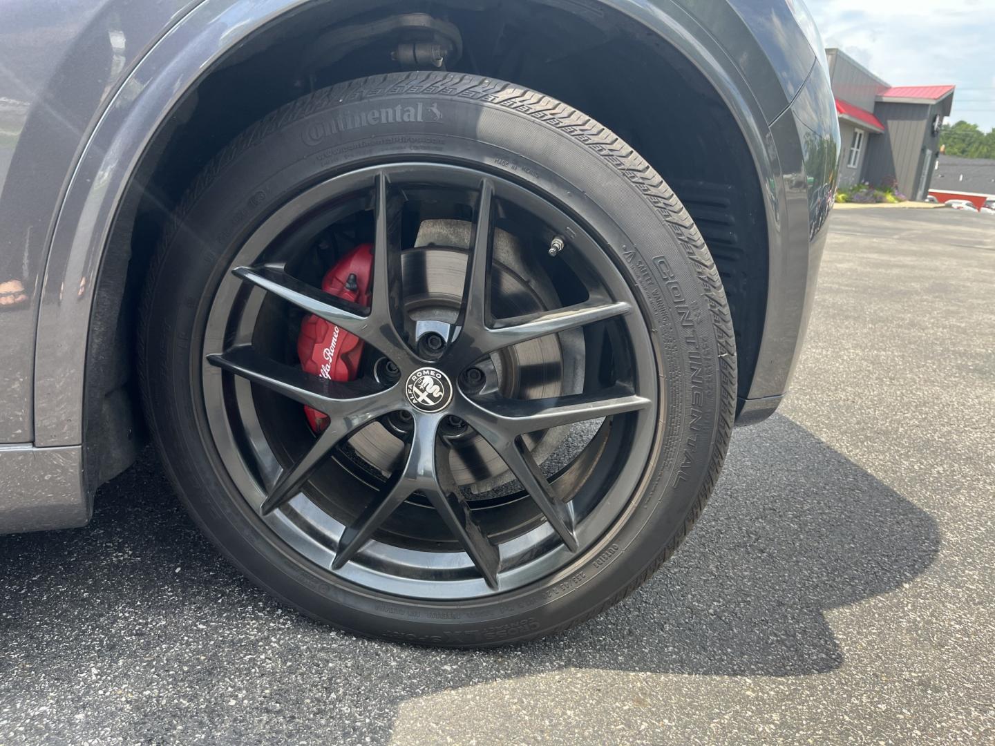 2021 Gray /Red Alfa Romeo Stelvio Ti Sport AWD (ZASPAKBN8M7) with an 2.0L I4 DOHC 16V Turbo engine, Automatic transmission, located at 11115 Chardon Rd. , Chardon, OH, 44024, (440) 214-9705, 41.580246, -81.241943 - 2021 Alfa Romeo Stelvio TI Sport AWD – Sporty Luxury SUV with Turbo Power and Premium Italian Refinement! This 2021 Alfa Romeo Stelvio TI Sport AWD is a dynamic and luxurious compact SUV that offers thrilling performance and upscale comfort. Powered by a responsive 2.0L Turbocharged I4 engine pro- Photo#4