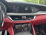 2021 Gray /Red Alfa Romeo Stelvio Ti Sport AWD (ZASPAKBN8M7) with an 2.0L I4 DOHC 16V Turbo engine, Automatic transmission, located at 11115 Chardon Rd. , Chardon, OH, 44024, (440) 214-9705, 41.580246, -81.241943 - 2021 Alfa Romeo Stelvio TI Sport AWD – Sporty Luxury SUV with Turbo Power and Premium Italian Refinement! This 2021 Alfa Romeo Stelvio TI Sport AWD is a dynamic and luxurious compact SUV that offers thrilling performance and upscale comfort. Powered by a responsive 2.0L Turbocharged I4 engine pro- Photo#23
