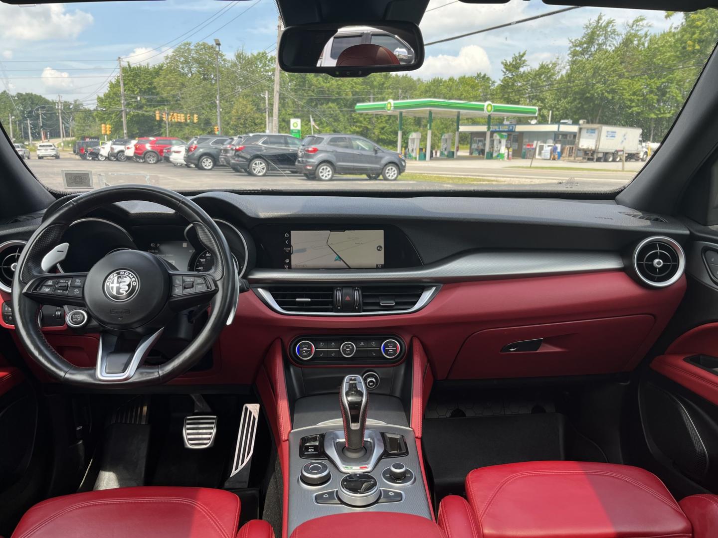 2021 Gray /Red Alfa Romeo Stelvio Ti Sport AWD (ZASPAKBN8M7) with an 2.0L I4 DOHC 16V Turbo engine, Automatic transmission, located at 11115 Chardon Rd. , Chardon, OH, 44024, (440) 214-9705, 41.580246, -81.241943 - 2021 Alfa Romeo Stelvio TI Sport AWD – Sporty Luxury SUV with Turbo Power and Premium Italian Refinement! This 2021 Alfa Romeo Stelvio TI Sport AWD is a dynamic and luxurious compact SUV that offers thrilling performance and upscale comfort. Powered by a responsive 2.0L Turbocharged I4 engine pro- Photo#31