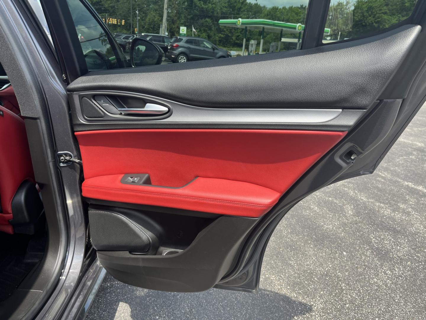 2021 Gray /Red Alfa Romeo Stelvio Ti Sport AWD (ZASPAKBN8M7) with an 2.0L I4 DOHC 16V Turbo engine, Automatic transmission, located at 11115 Chardon Rd. , Chardon, OH, 44024, (440) 214-9705, 41.580246, -81.241943 - 2021 Alfa Romeo Stelvio TI Sport AWD – Sporty Luxury SUV with Turbo Power and Premium Italian Refinement! This 2021 Alfa Romeo Stelvio TI Sport AWD is a dynamic and luxurious compact SUV that offers thrilling performance and upscale comfort. Powered by a responsive 2.0L Turbocharged I4 engine pro- Photo#32