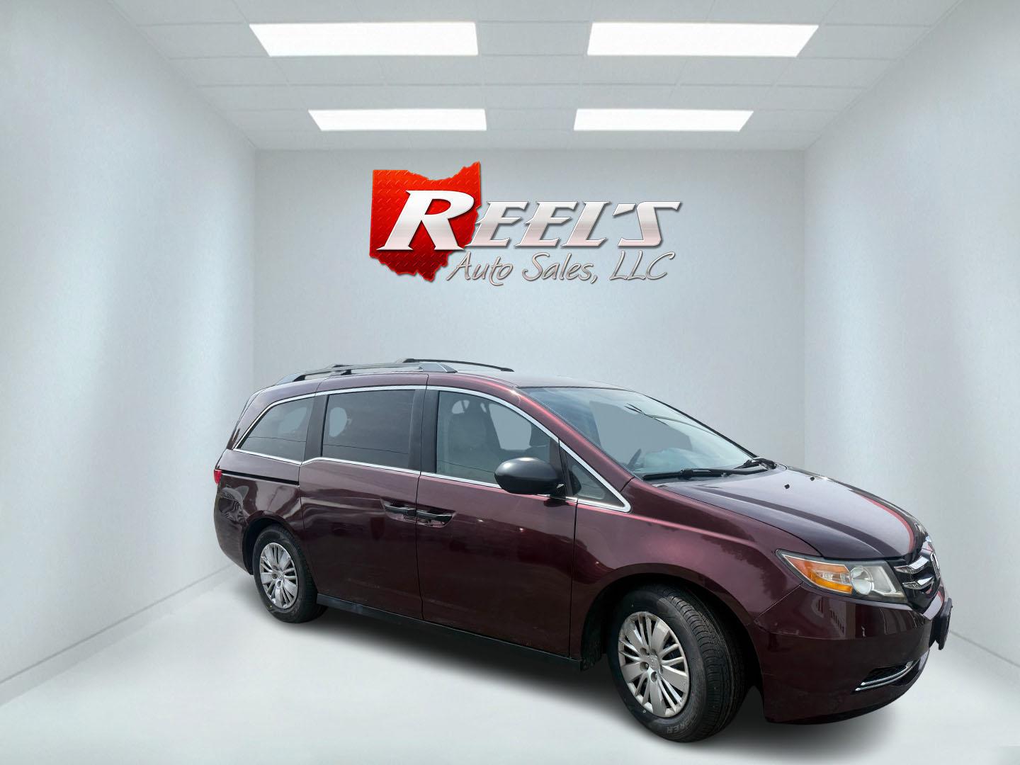 2014 Red /Tan Honda Odyssey LX (5FNRL5H28EB) with an 3.5L V6 SOHC 24V engine, Automatic transmission, located at 547 E. Main St., Orwell, OH, 44076, (440) 437-5893, 41.535435, -80.847855 - 2014 Honda Odyssey LX – Spacious Family Minivan with Fresh Tires and Reliable V6 Power! This 2014 Honda Odyssey LX is a practical and family-friendly minivan that offers generous space and dependable performance. Powered by a smooth 3.5L V6 engine paired with a responsive 6-speed automatic transm- Photo#3