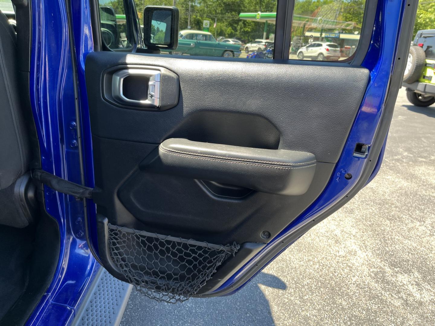 2018 Blue /Black Jeep Wrangler JL Unlimited Sahara (1C4HJXEGXJW) with an 3.6L V6 DOHC 24V engine, Automatic transmission, located at 547 E. Main St., Orwell, OH, 44076, (440) 437-5893, 41.535435, -80.847855 - 2018 Jeep Wrangler Unlimited Sahara 4WD – Iconic Off-Roader with Fresh All-Terrain Tires and Modern Features! This 2018 Jeep Wrangler Unlimited Sahara is a clean and capable 4-door that’s ready for trails or daily driving. Powered by the reliable 3.6L Pentastar V6 engine paired with a smooth 8-- Photo#34