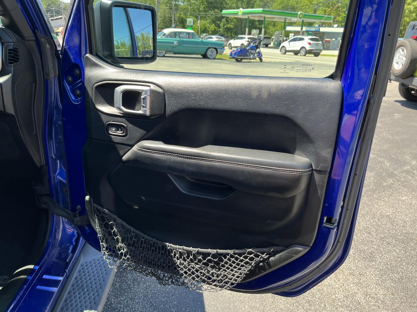 2018 Blue /Black Jeep Wrangler JL Unlimited Sahara (1C4HJXEGXJW) with an 3.6L V6 DOHC 24V engine, Automatic transmission, located at 547 E. Main St., Orwell, OH, 44076, (440) 437-5893, 41.535435, -80.847855 - 2018 Jeep Wrangler Unlimited Sahara 4WD – Iconic Off-Roader with Fresh All-Terrain Tires and Modern Features! This 2018 Jeep Wrangler Unlimited Sahara is a clean and capable 4-door that’s ready for trails or daily driving. Powered by the reliable 3.6L Pentastar V6 engine paired with a smooth 8-- Photo#36