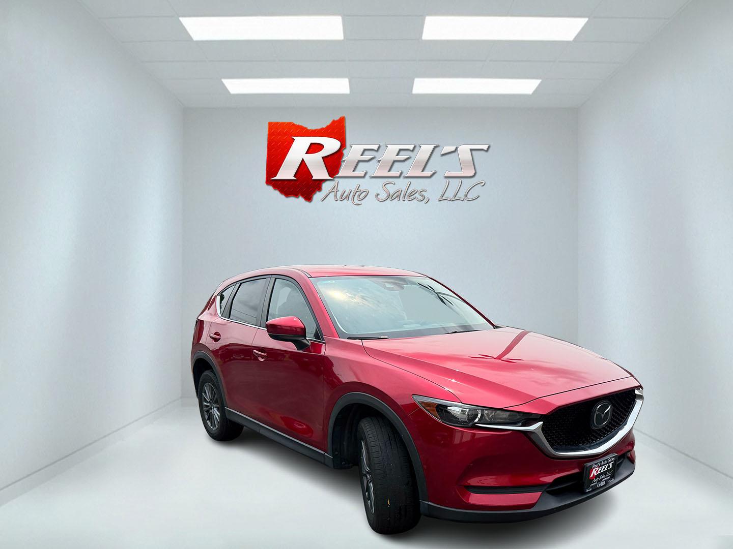 2019 Red /Black Mazda CX-5 Touring AWD (JM3KFBCM1K1) with an 2.5L I4 DOHC 16V engine, Automatic transmission, located at 547 E. Main St., Orwell, OH, 44076, (440) 437-5893, 41.535435, -80.847855 - 2019 Mazda CX-5 Touring AWD – The Compact SUV That Feels a Step Above Some crossovers simply check boxes. This 2019 Mazda CX-5 Touring AWD does more than that — it feels carefully designed. The 2.5L engine and 6-speed automatic work together smoothly, while available AWD gives you confidence wh- Photo#3