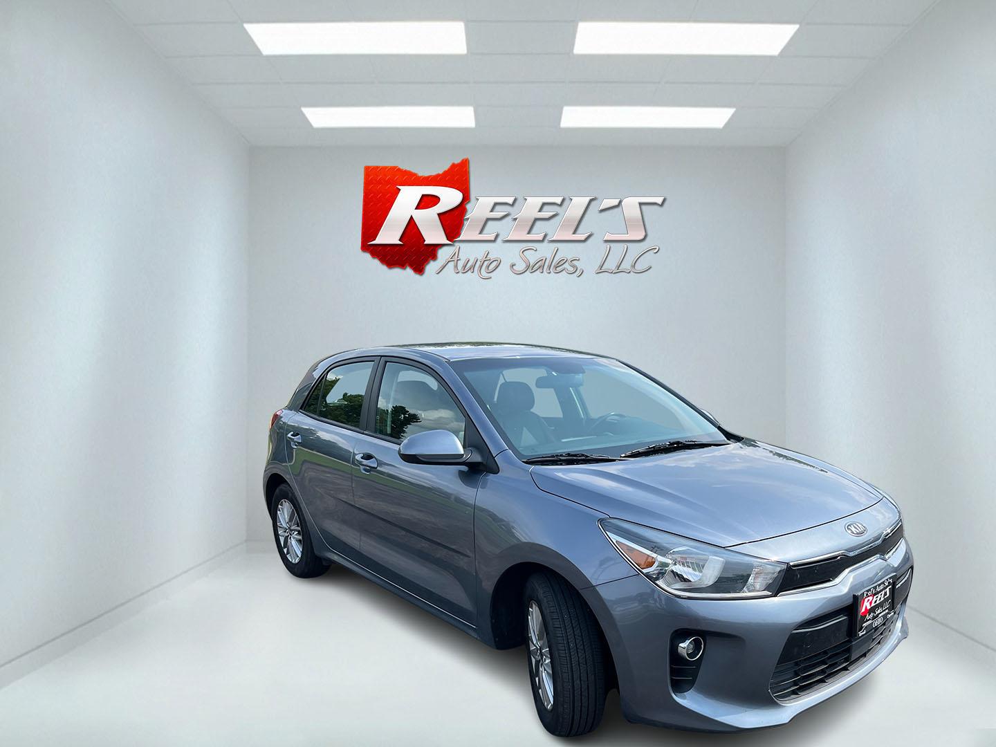 2018 Gray /Black Kia Rio5 EX (3KPA35AB8JE) with an 1.6L I4 DOHC 16V engine, Automatic transmission, located at 11115 Chardon Rd. , Chardon, OH, 44024, (440) 214-9705, 41.580246, -81.241943 - 2018 Kia Rio EX Hatchback Launch Edition – Stylish, Efficient, and Surprisingly Refined Looking for a compact car that feels a step above the ordinary? This 2018 Kia Rio EX Hatchback Launch Edition delivers exactly that. Powered by a responsive 1.6L GDI engine and smooth 6-speed automatic, it ret- Photo#3