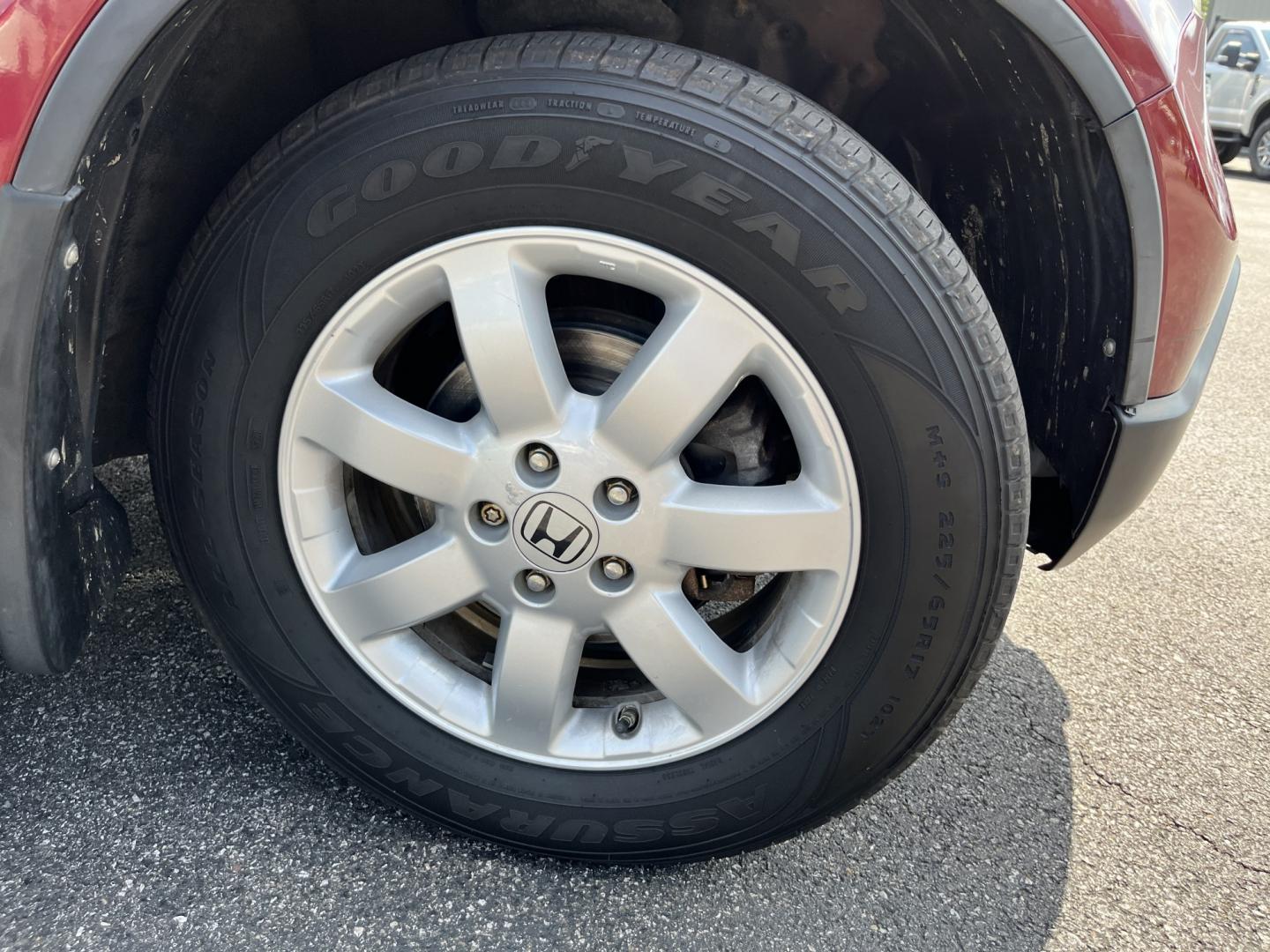 2009 Red /Gray Honda CR-V EX-L 4WD 5-Speed AT (5J6RE48749L) with an 2.4L I4 DOHC 16V engine, Automatic transmission, located at 11115 Chardon Rd. , Chardon, OH, 44024, (440) 214-9705, 41.580246, -81.241943- Photo#4