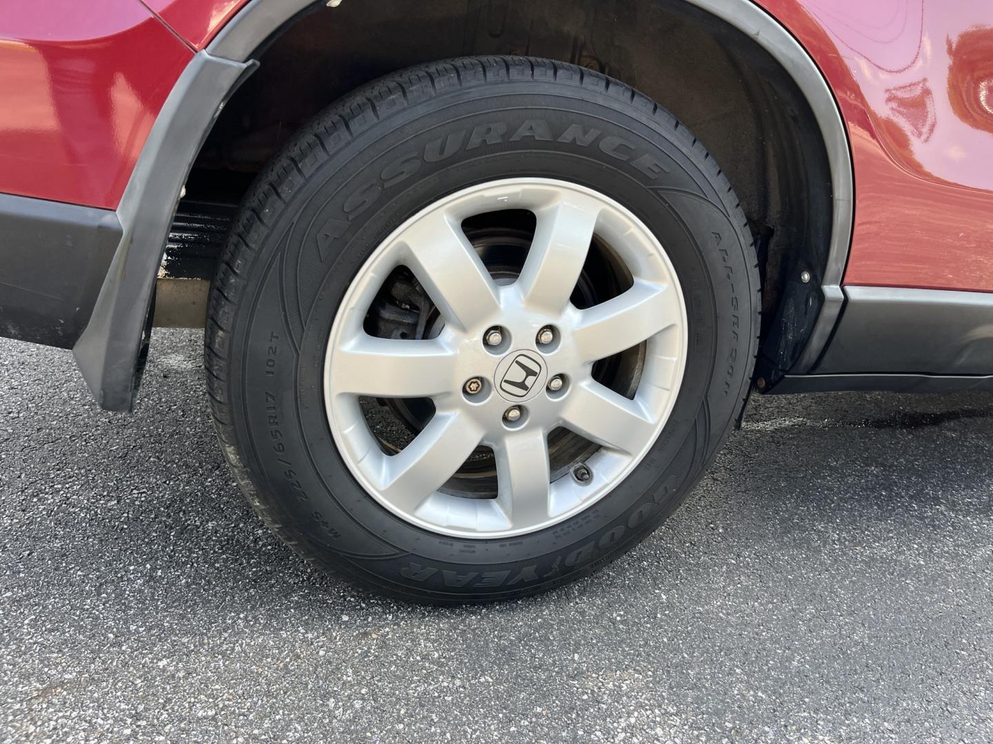 2009 Red /Gray Honda CR-V EX-L 4WD 5-Speed AT (5J6RE48749L) with an 2.4L I4 DOHC 16V engine, Automatic transmission, located at 11115 Chardon Rd. , Chardon, OH, 44024, (440) 214-9705, 41.580246, -81.241943- Photo#7