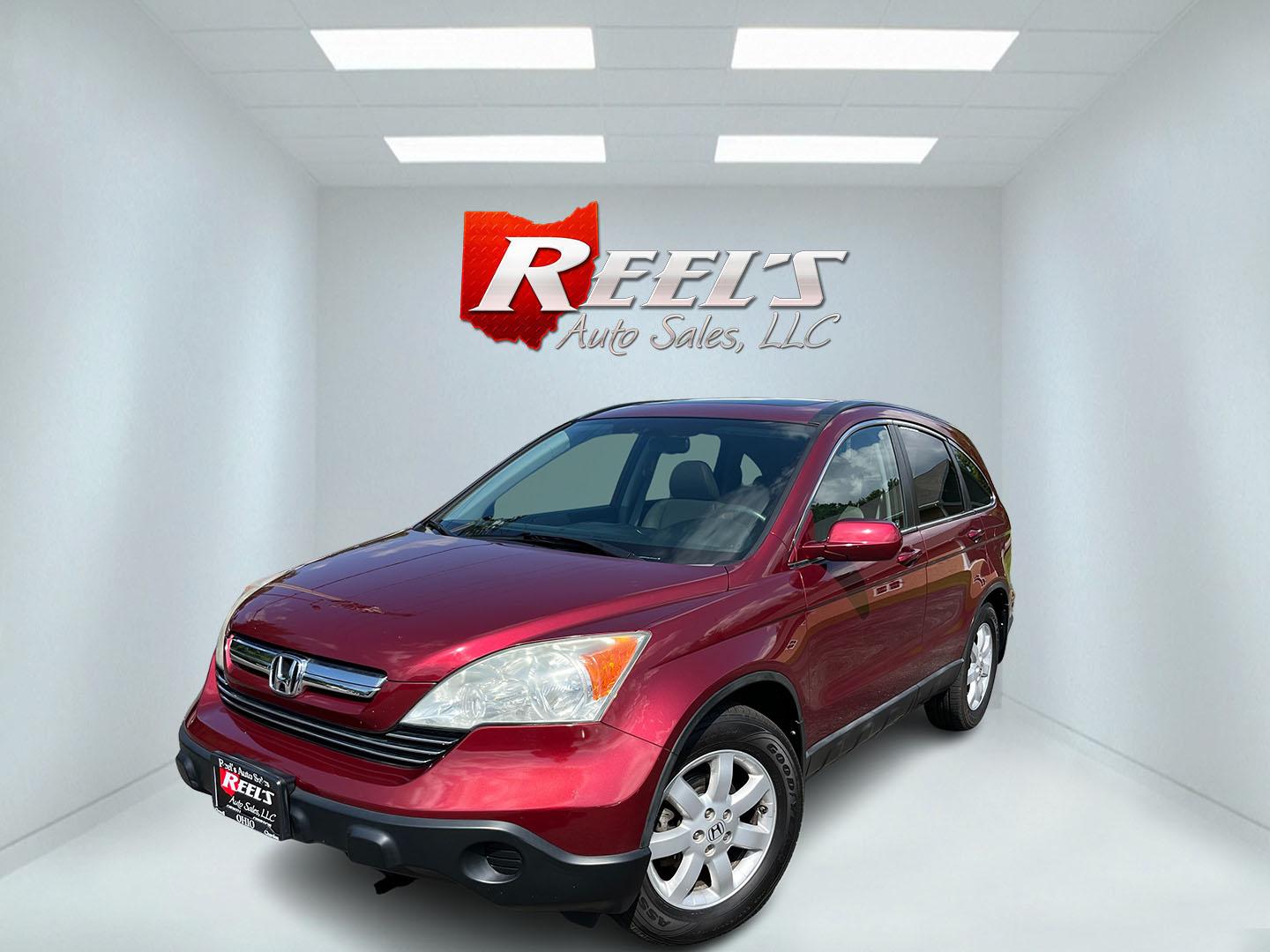 2009 Red /Gray Honda CR-V EX-L 4WD 5-Speed AT (5J6RE48749L) with an 2.4L I4 DOHC 16V engine, Automatic transmission, located at 11115 Chardon Rd. , Chardon, OH, 44024, (440) 214-9705, 41.580246, -81.241943- Photo#0