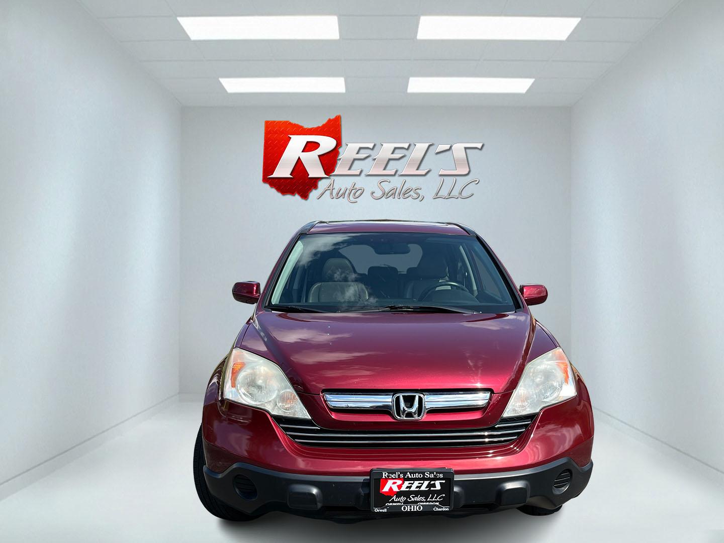 2009 Red /Gray Honda CR-V EX-L 4WD 5-Speed AT (5J6RE48749L) with an 2.4L I4 DOHC 16V engine, Automatic transmission, located at 11115 Chardon Rd. , Chardon, OH, 44024, (440) 214-9705, 41.580246, -81.241943- Photo#1
